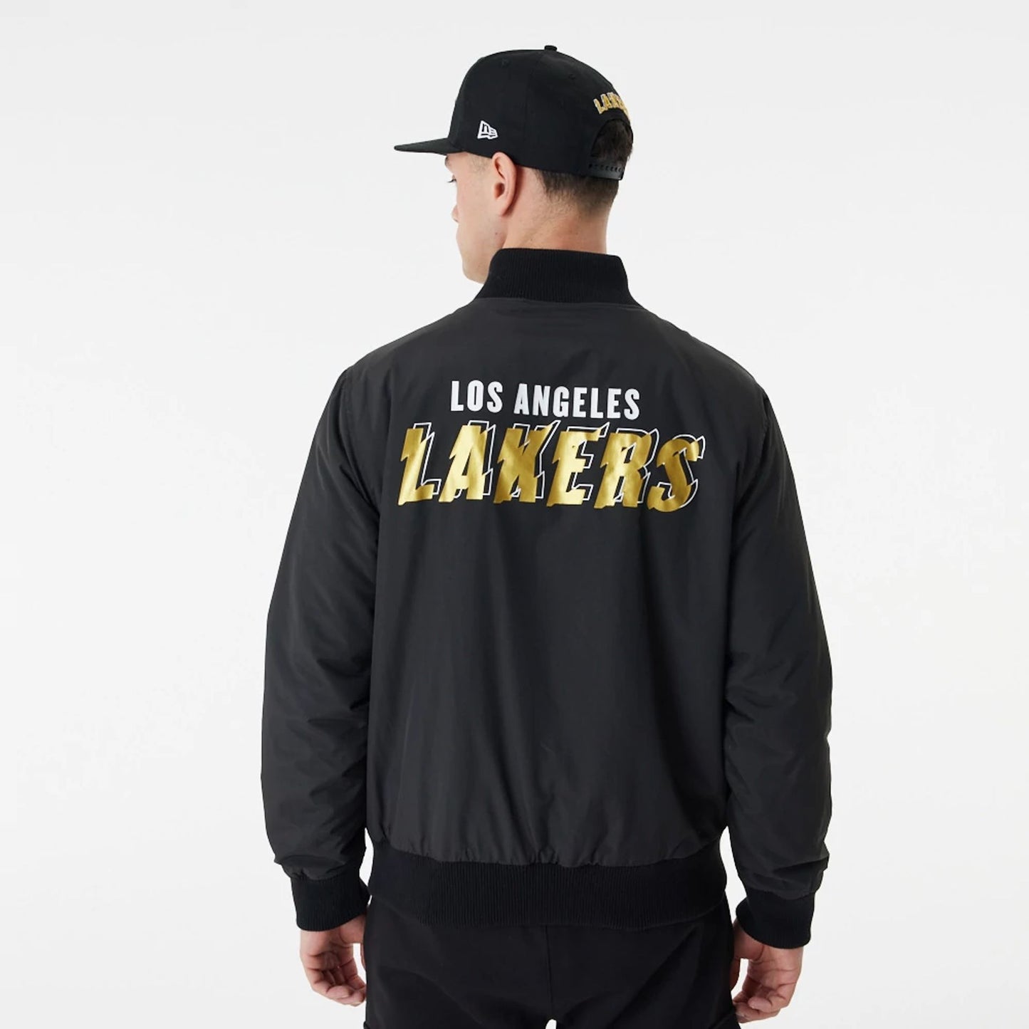 The Male model is wearing LA Lakers Gold Team Script Black Bomber Jacket 4