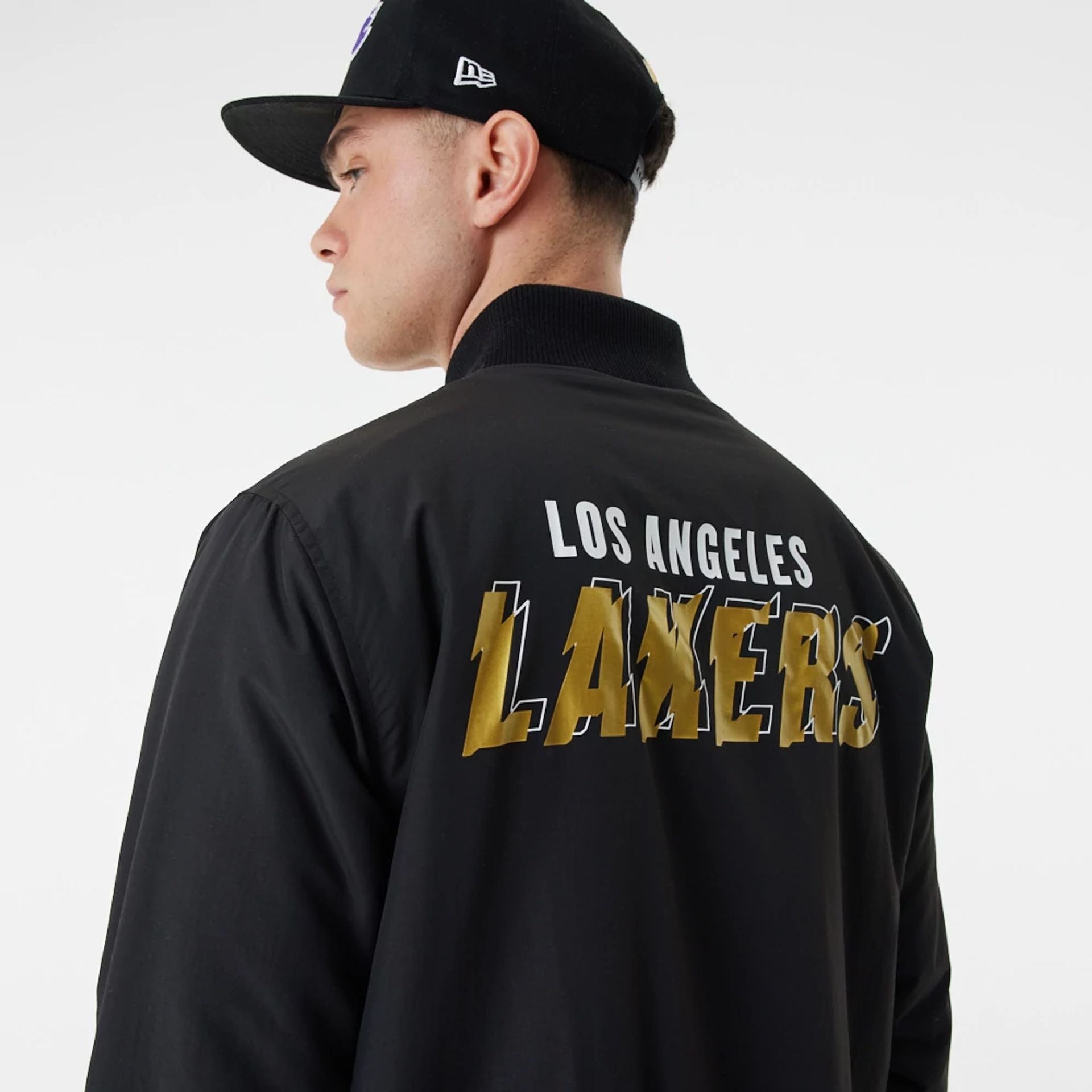 The Male model is wearing LA Lakers Gold Team Script Black Bomber Jacket 1