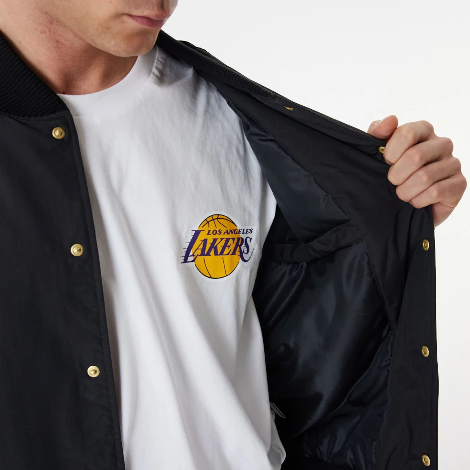 The Male model is wearing LA Lakers Gold Team Script Black Bomber Jacket 3