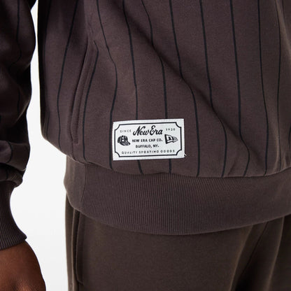 The Male model is wearing New Era Heritage Pinstripe Brown Oversized Hoodie 8