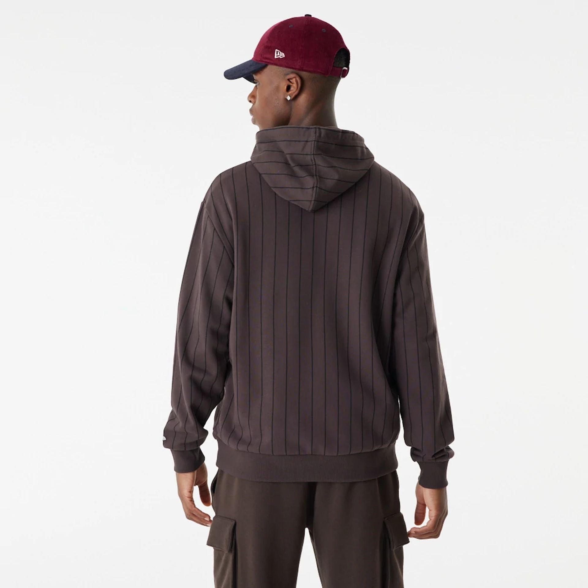 The Male model is wearing New Era Heritage Pinstripe Brown Oversized Hoodie 5