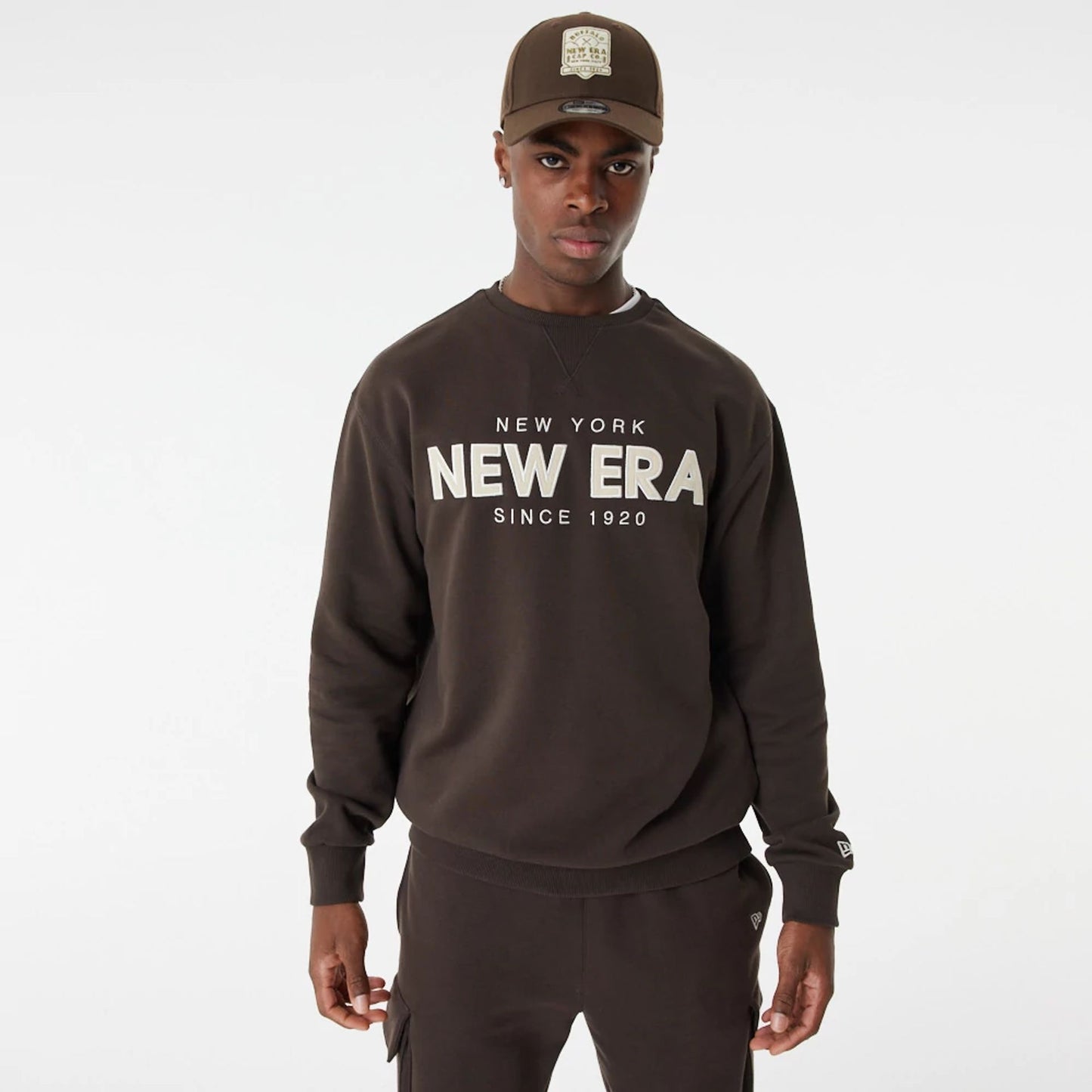 The Male model is wearing New Era Heritage Brown Crew Neck Sweatshirt 6