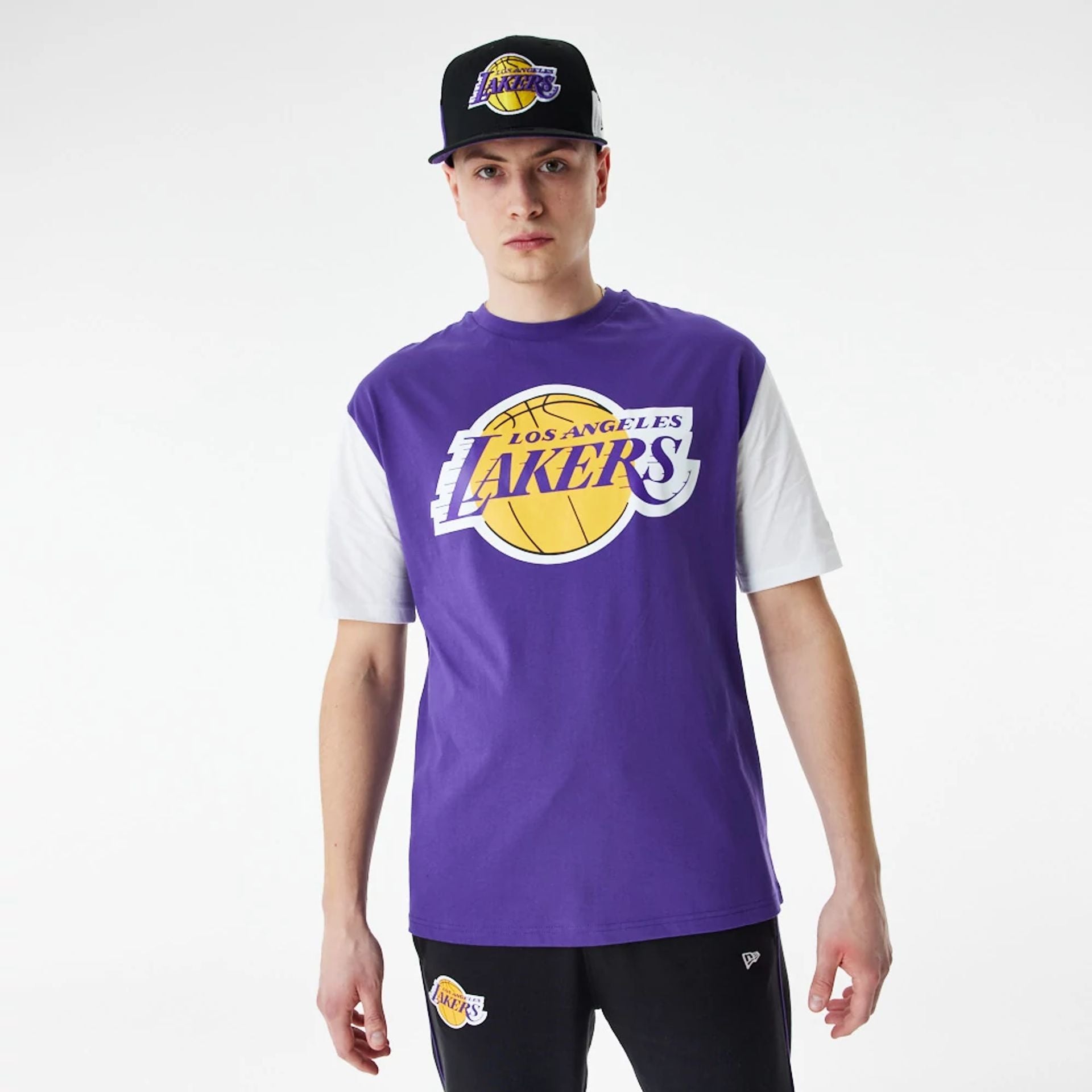 The Male model is wearing LA Lakers NBA Colour Block Purple Oversized T-Shirt 1