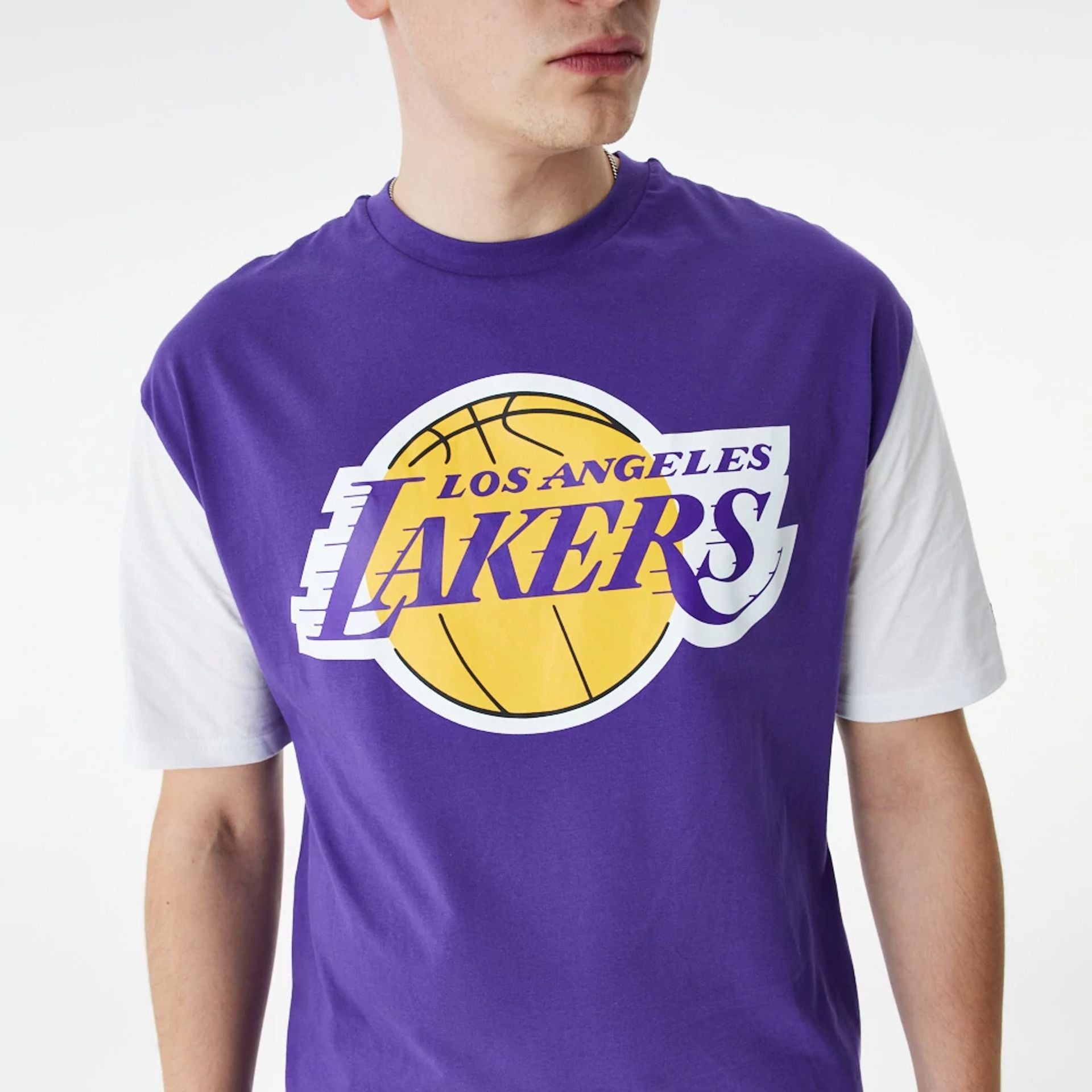 The Male model is wearing LA Lakers NBA Colour Block Purple Oversized T-Shirt 2