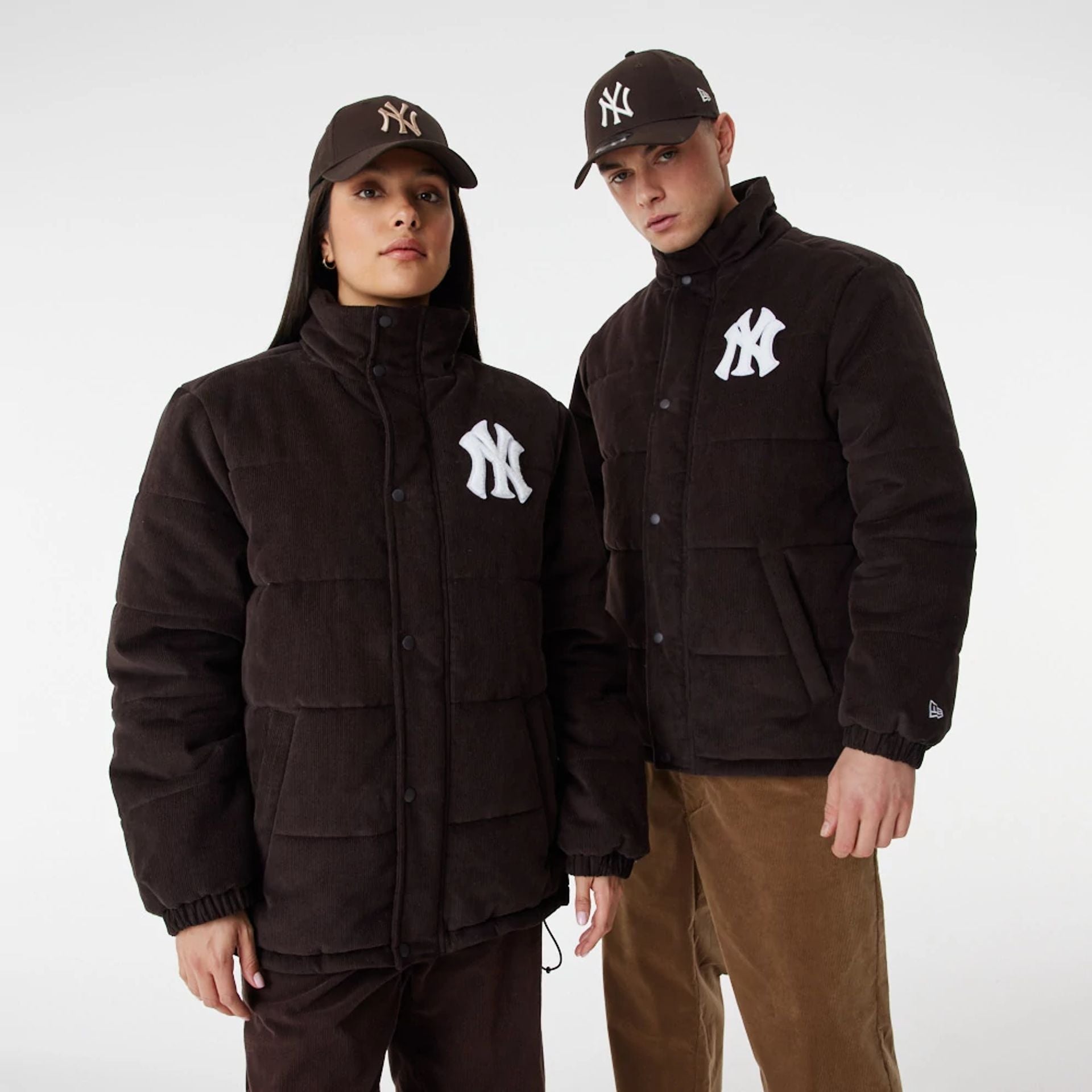 The Male model is wearing New York Yankees MLB Brown Puffer Jacket 1