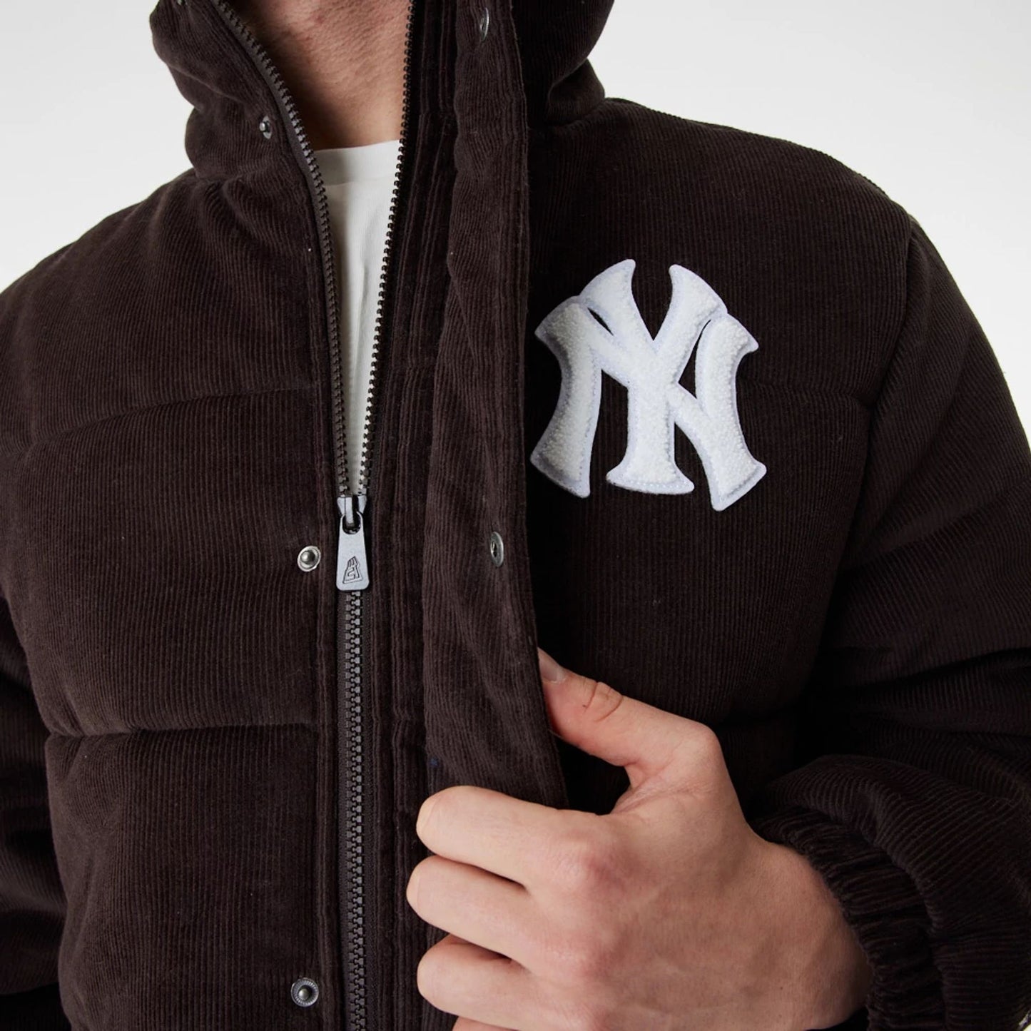 The Male model is wearing New York Yankees MLB Brown Puffer Jacket 8