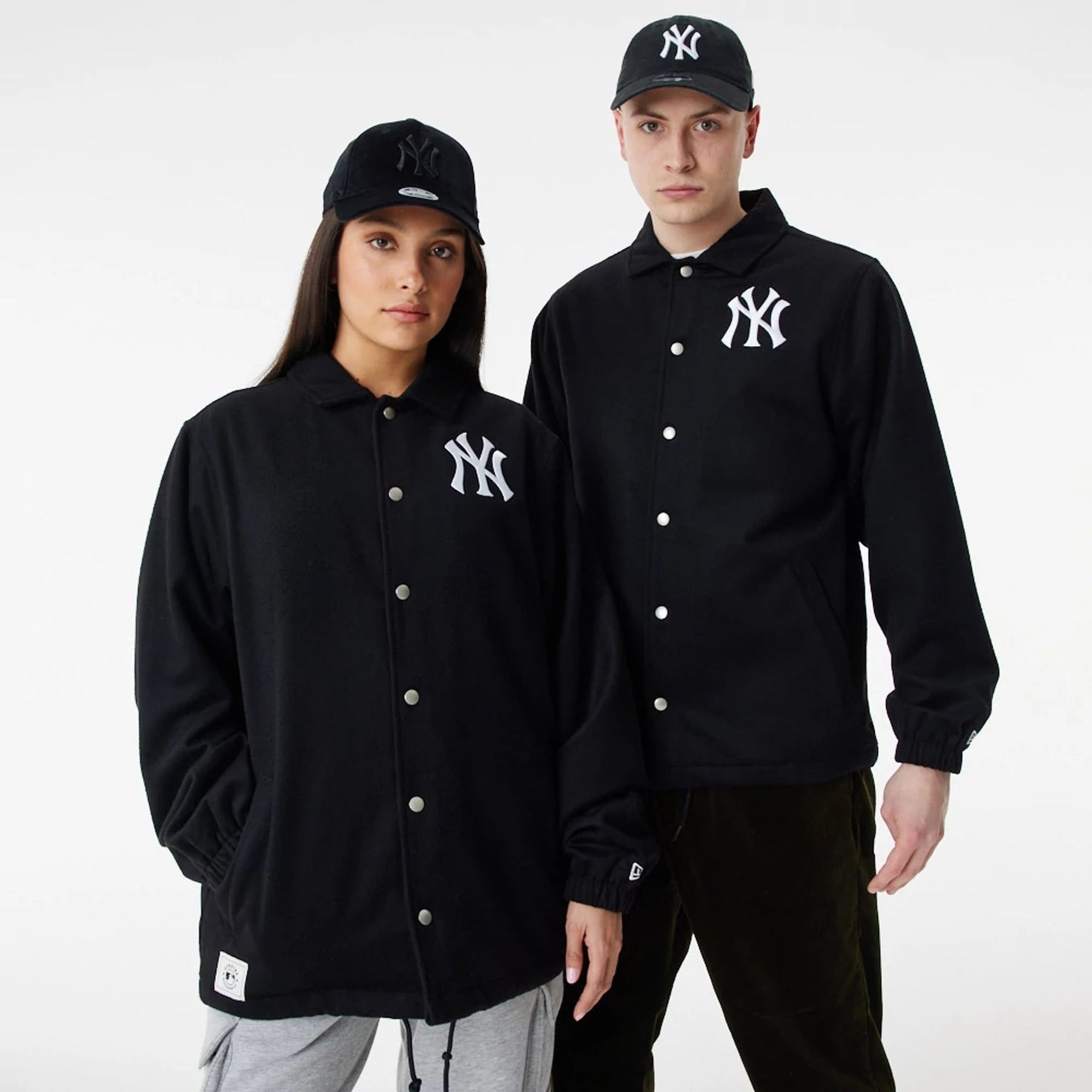 The Male model is wearing New York Yankees MLB Black Coaches Jacket 1