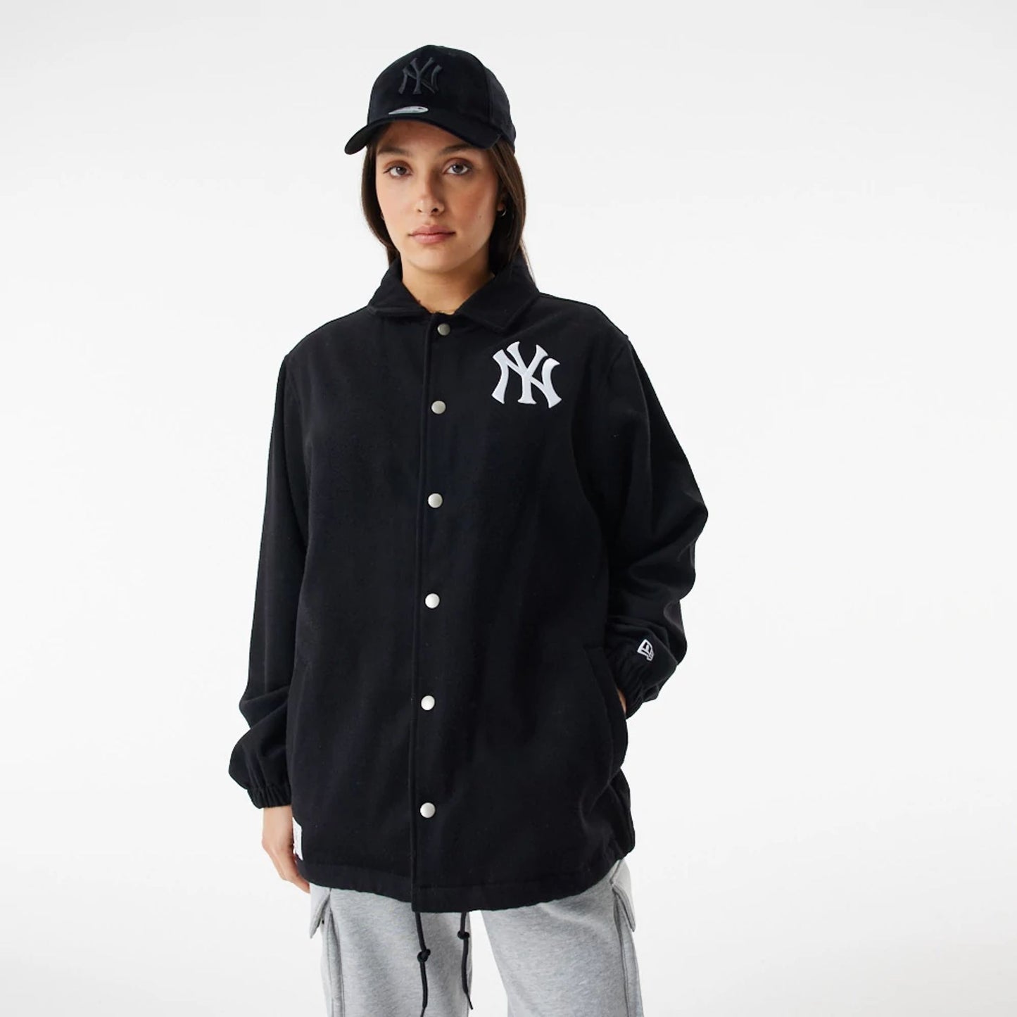 The Male model is wearing New York Yankees MLB Black Coaches Jacket 3