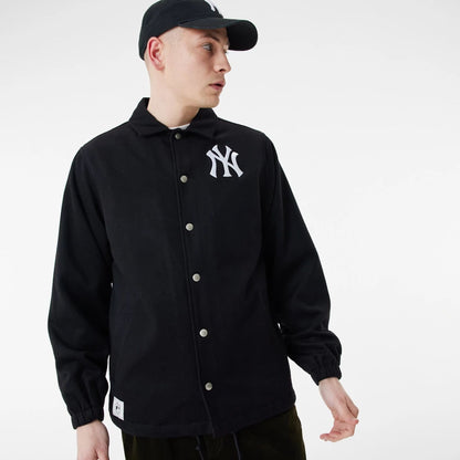 The Male model is wearing New York Yankees MLB Black Coaches Jacket 7