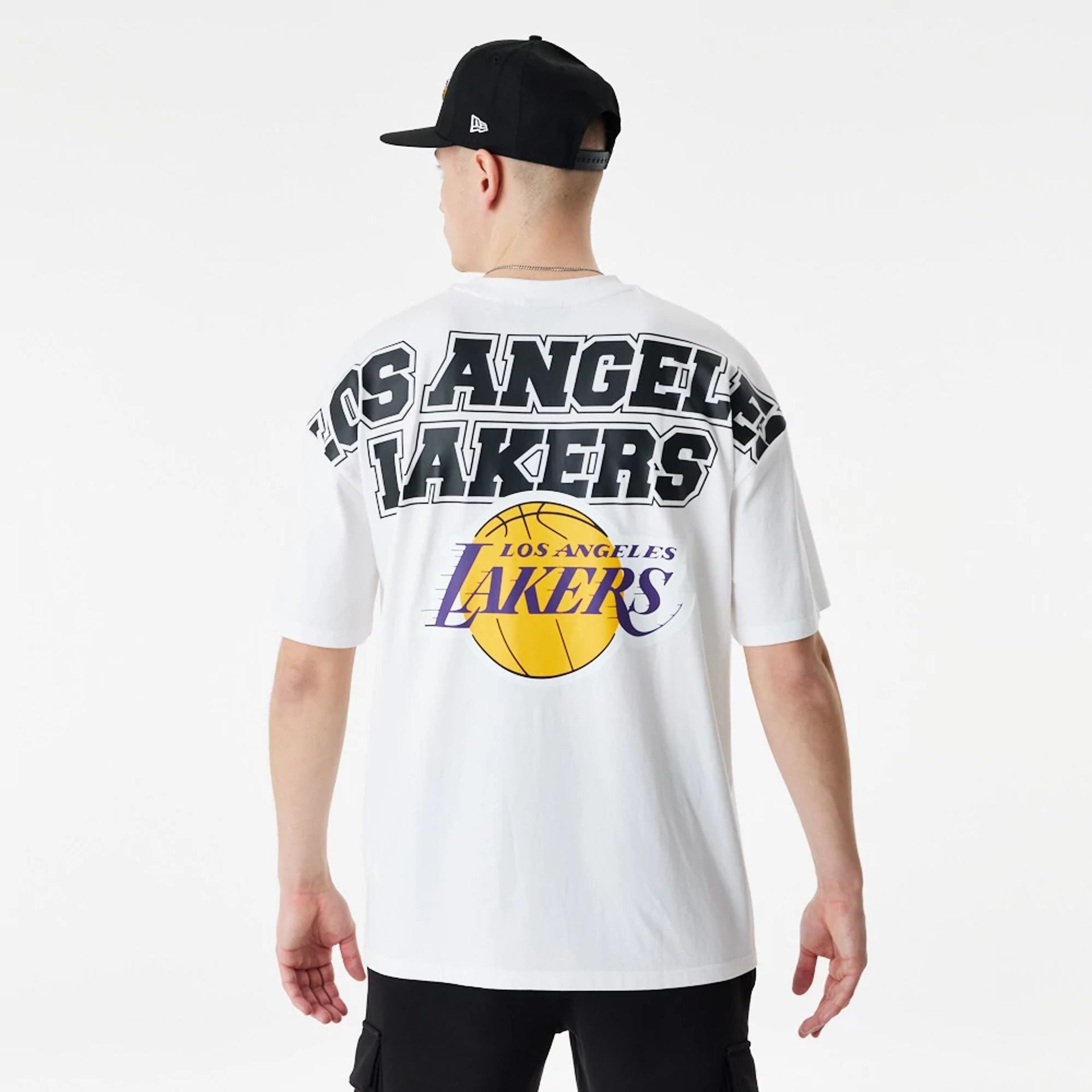 The Male model is wearing LA Lakers NBA Large Graphic White Oversized T-Shirt 1