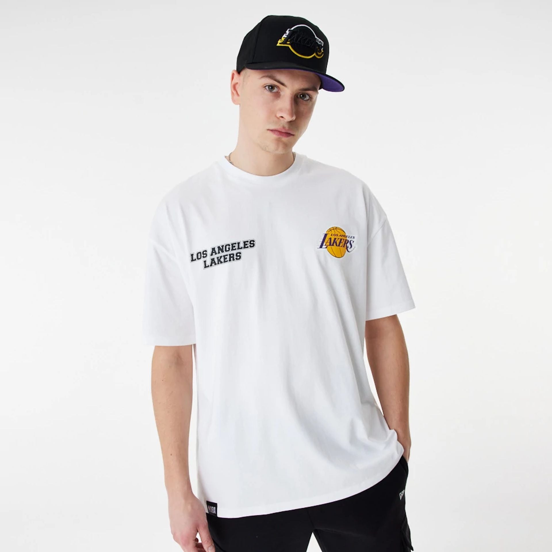 The Male model is wearing LA Lakers NBA Large Graphic White Oversized T-Shirt 2