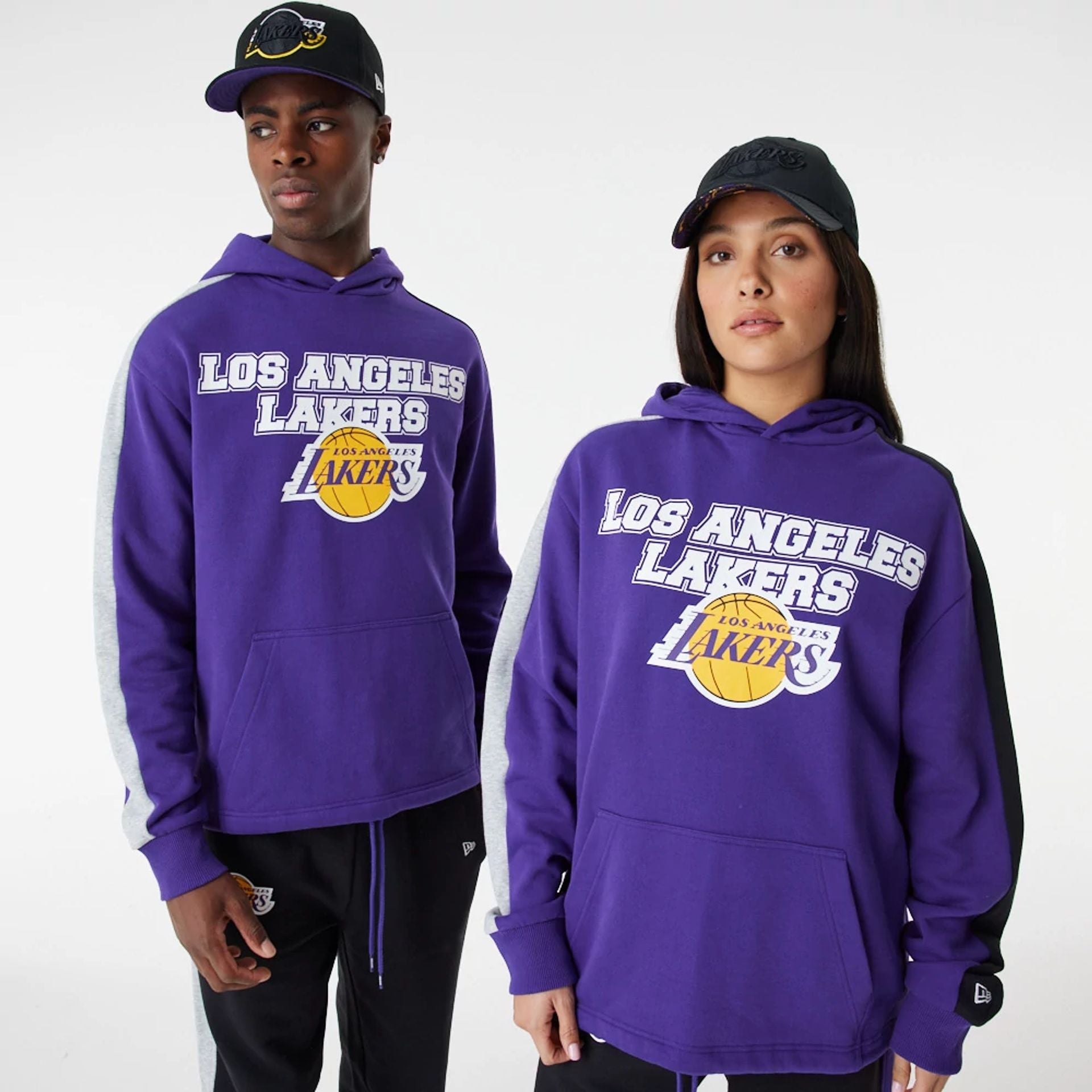 The Male model is wearing LA Lakers NBA Large Graphic Purple Oversized Hoodie 1