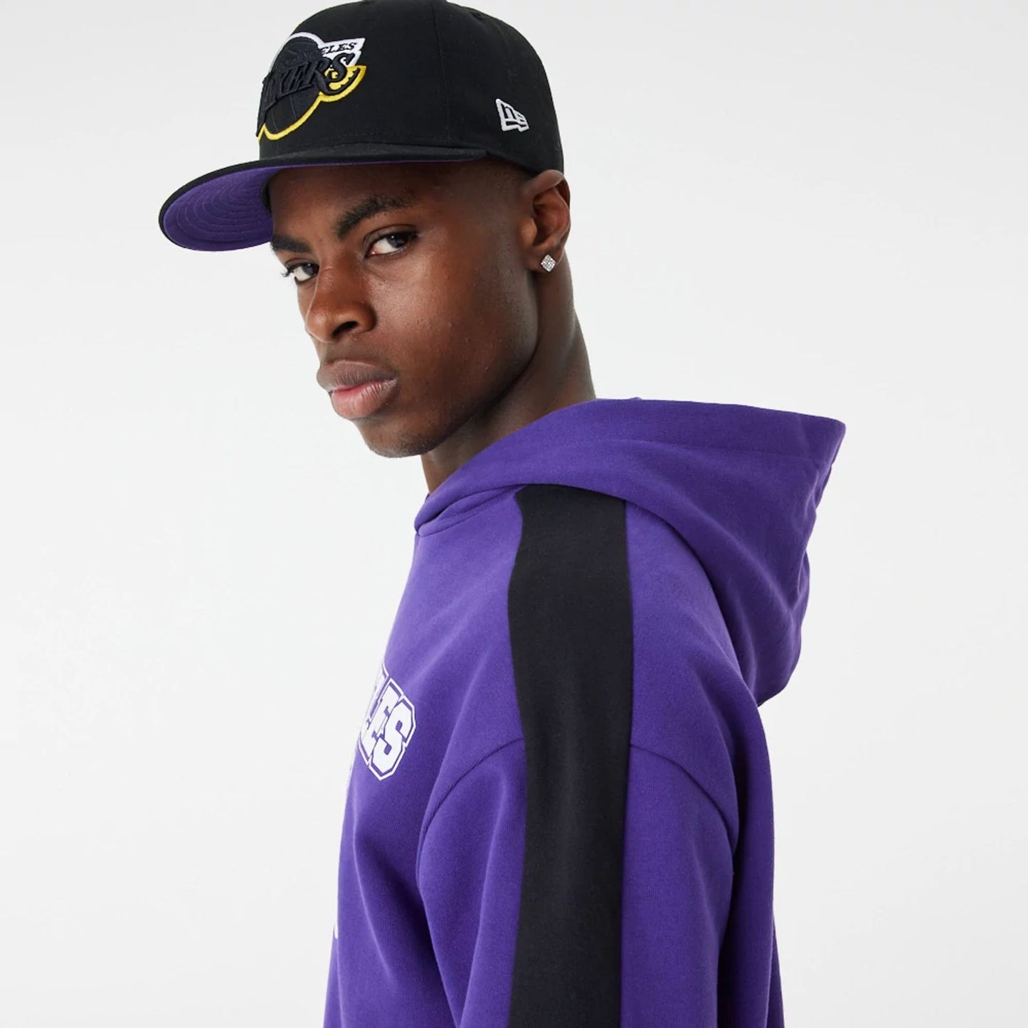 The Male model is wearing LA Lakers NBA Large Graphic Purple Oversized Hoodie 7