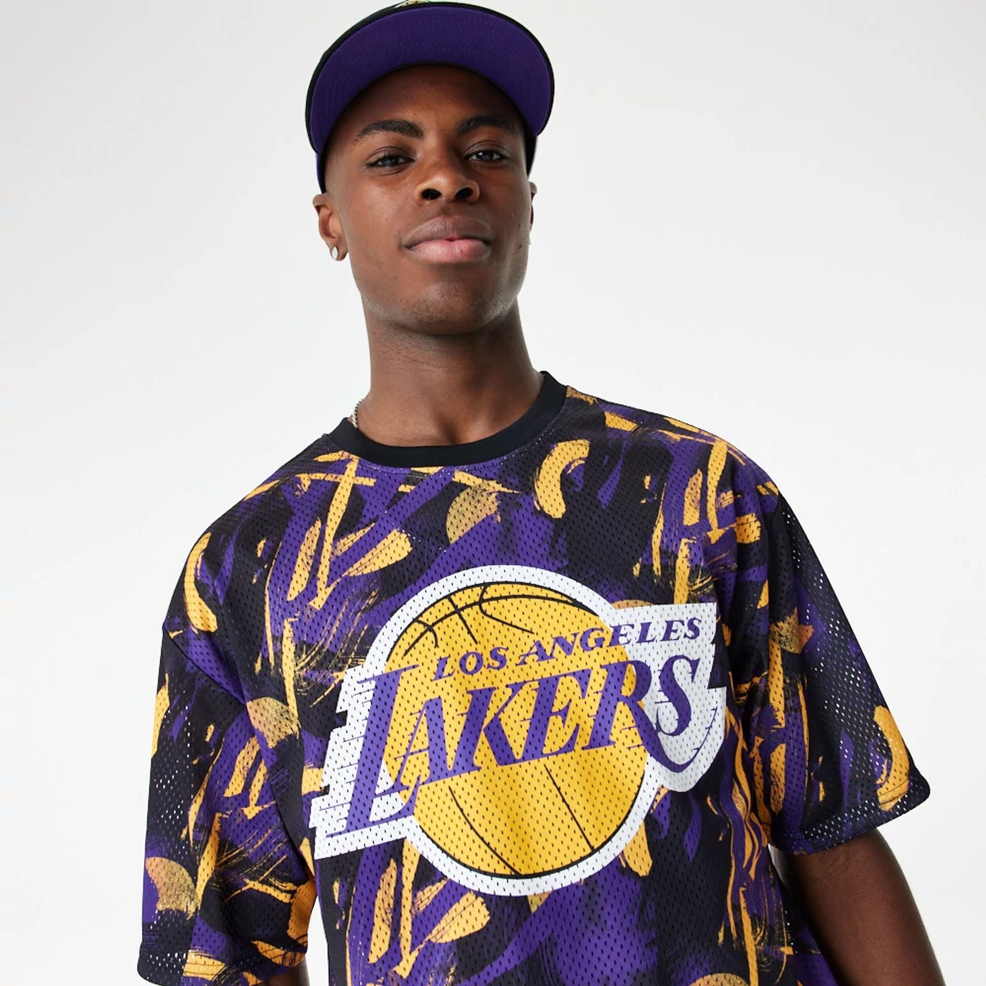 The Male model is wearing LA Lakers NBA All Over Print Mesh Purple Oversized T-Shirt 2