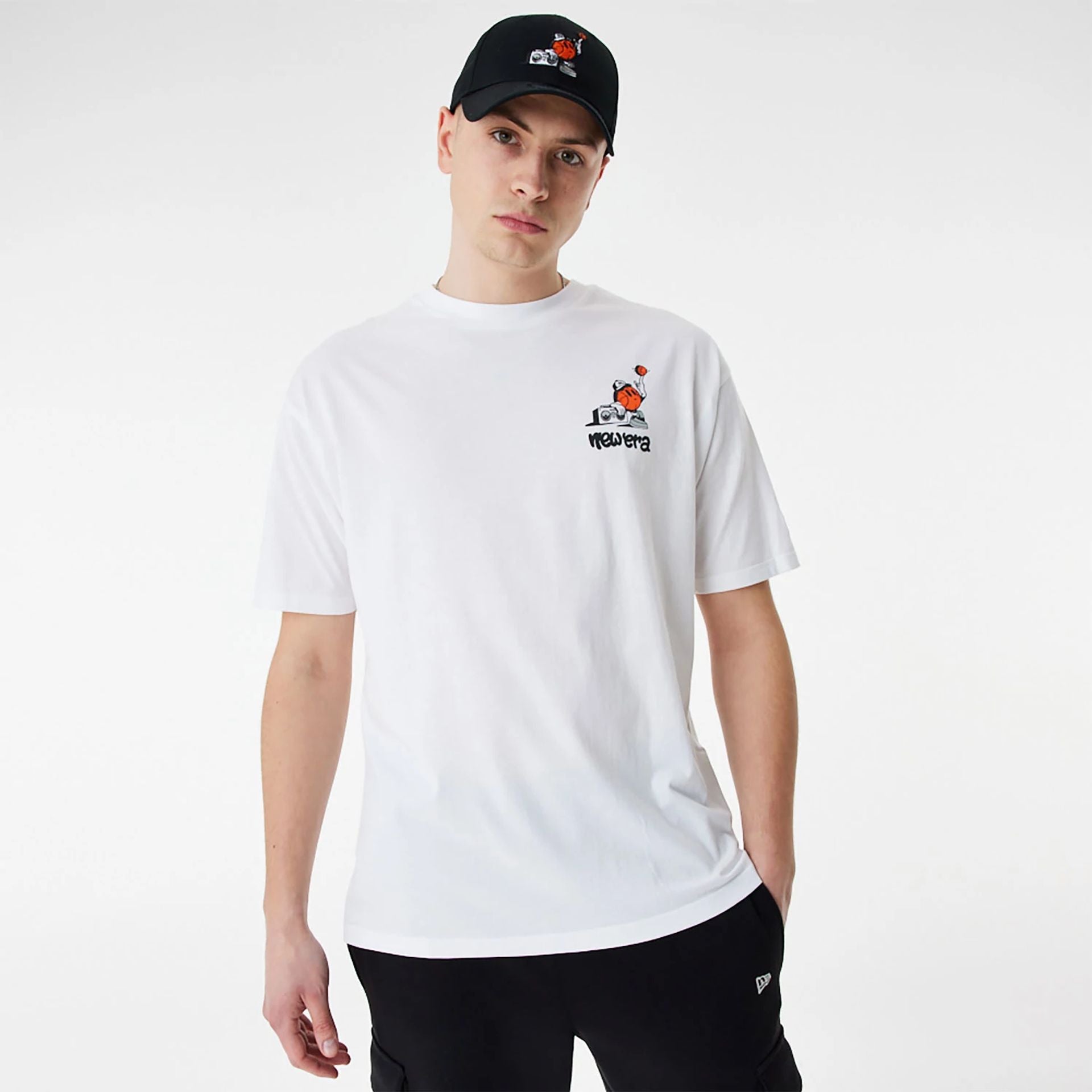 The Male model is wearing New Era Basketball Graffiti Graphic White Oversized T-Shirt 2