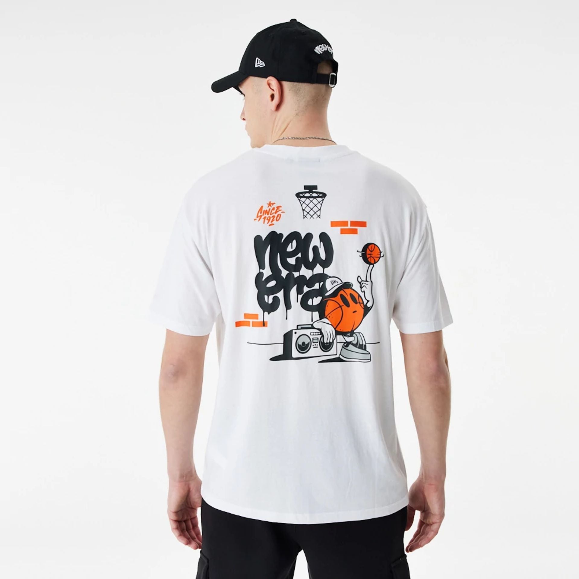 The Male model is wearing New Era Basketball Graffiti Graphic White Oversized T-Shirt 1