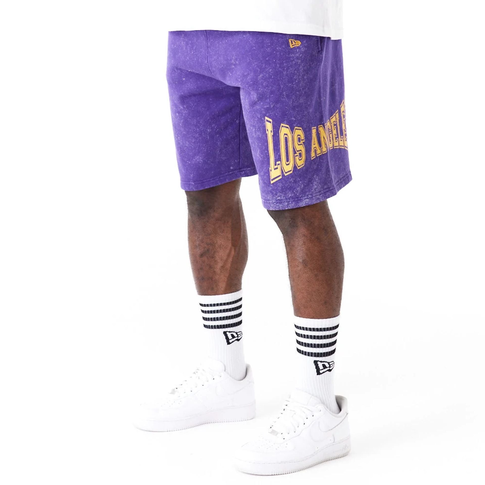 The Male model is wearing LA Lakers NBA Washed Purple Shorts 1