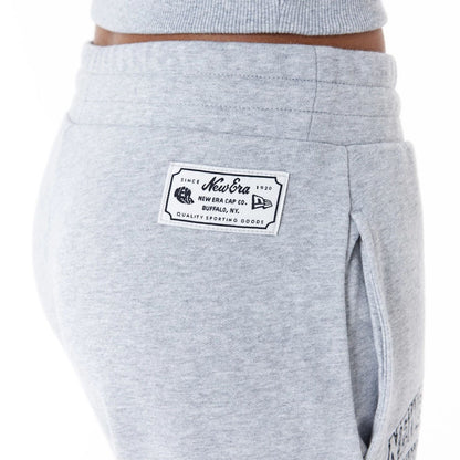 The Female model is wearing New Era Womens Arch Wordmark Grey Joggers 3