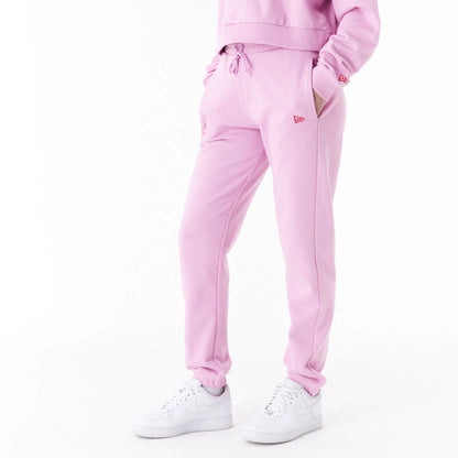 The Female model is wearing New Era Womens Arch Wordmark Pink Joggers 5