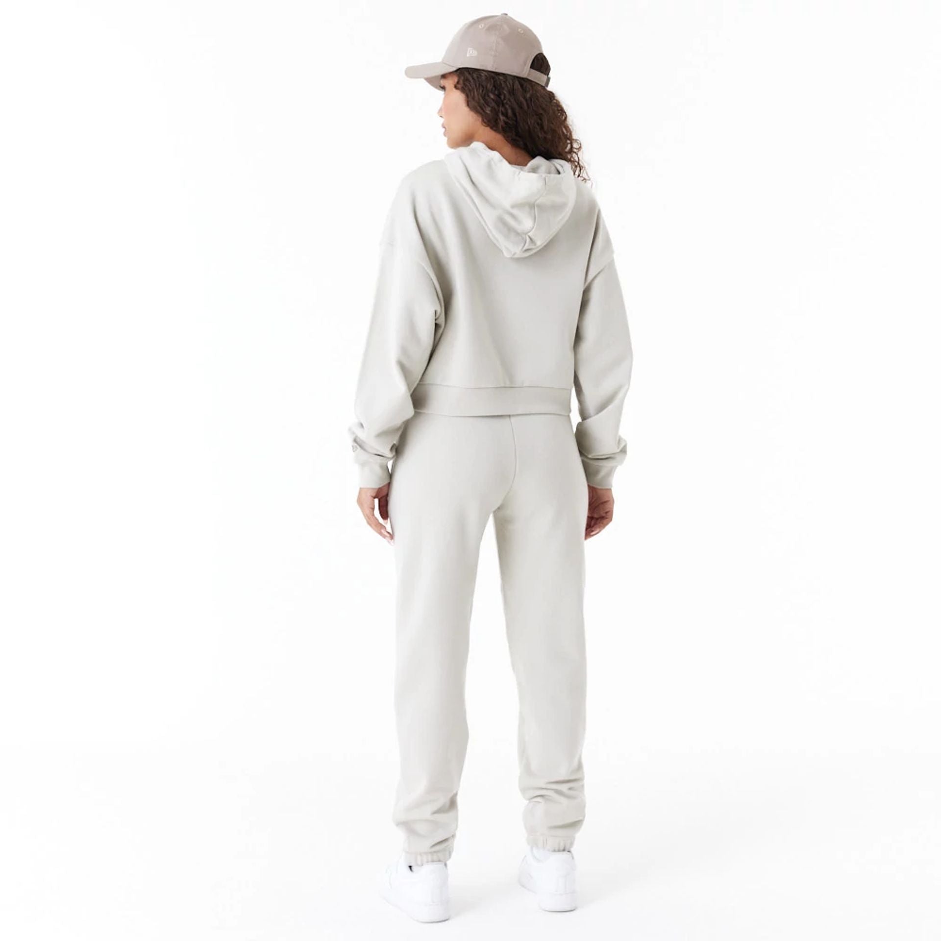 The Female model is wearing New Era Arch Wordmark Stone Womens Joggers 2