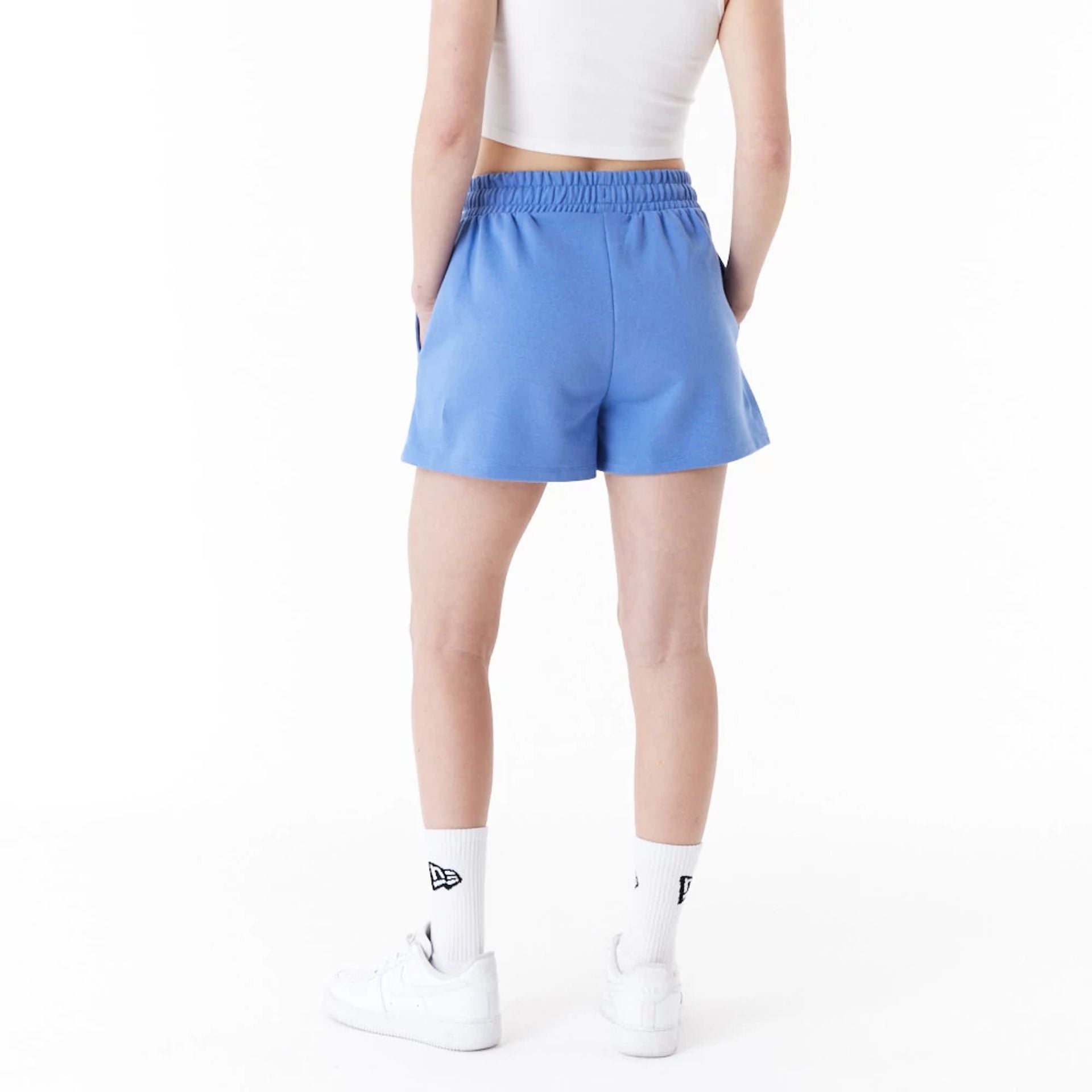 The Female model is wearing New Era Blue Womens Sweat Shorts 3