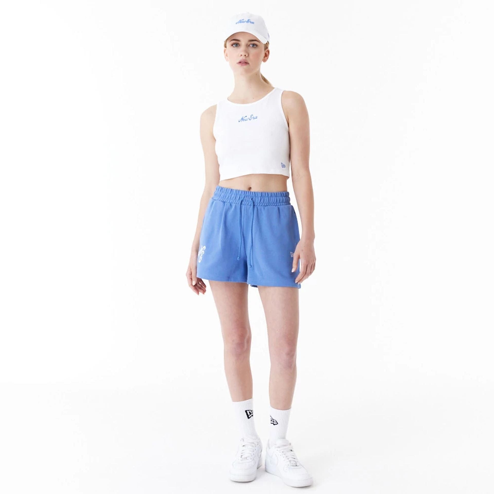 The Female model is wearing New Era Blue Womens Sweat Shorts 4