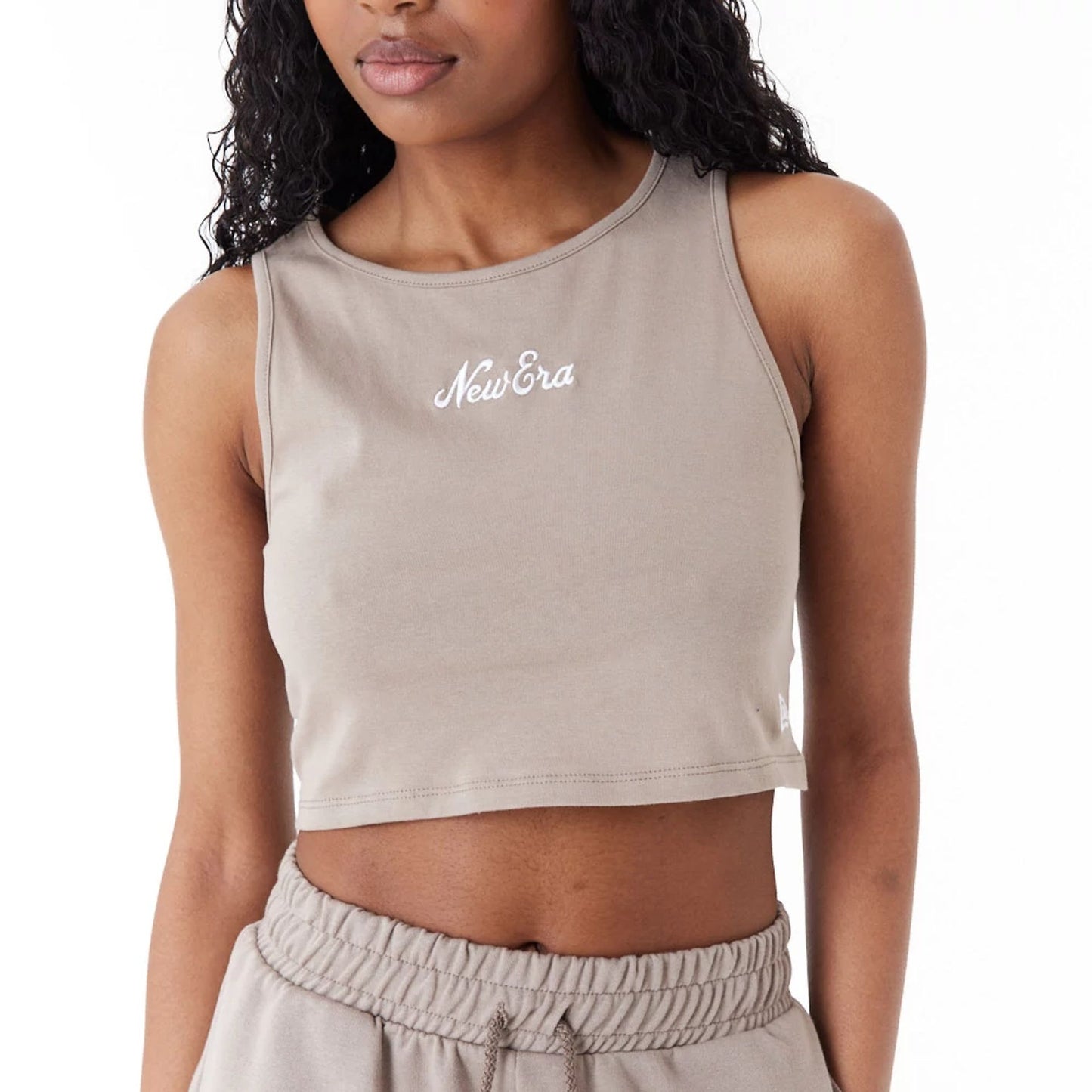 The Female model is wearing New Era Womens Brown Crop Tank Top 6