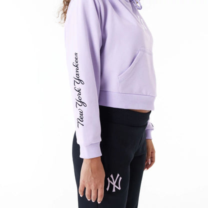 The Female model is wearing New York Yankees MLB Lifestyle Purple Womens Crop Pullover Hoodie 8