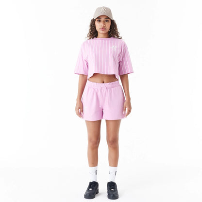 The Female model is wearing New Era Pinstripe Pink Womens Crop T-Shirt 3