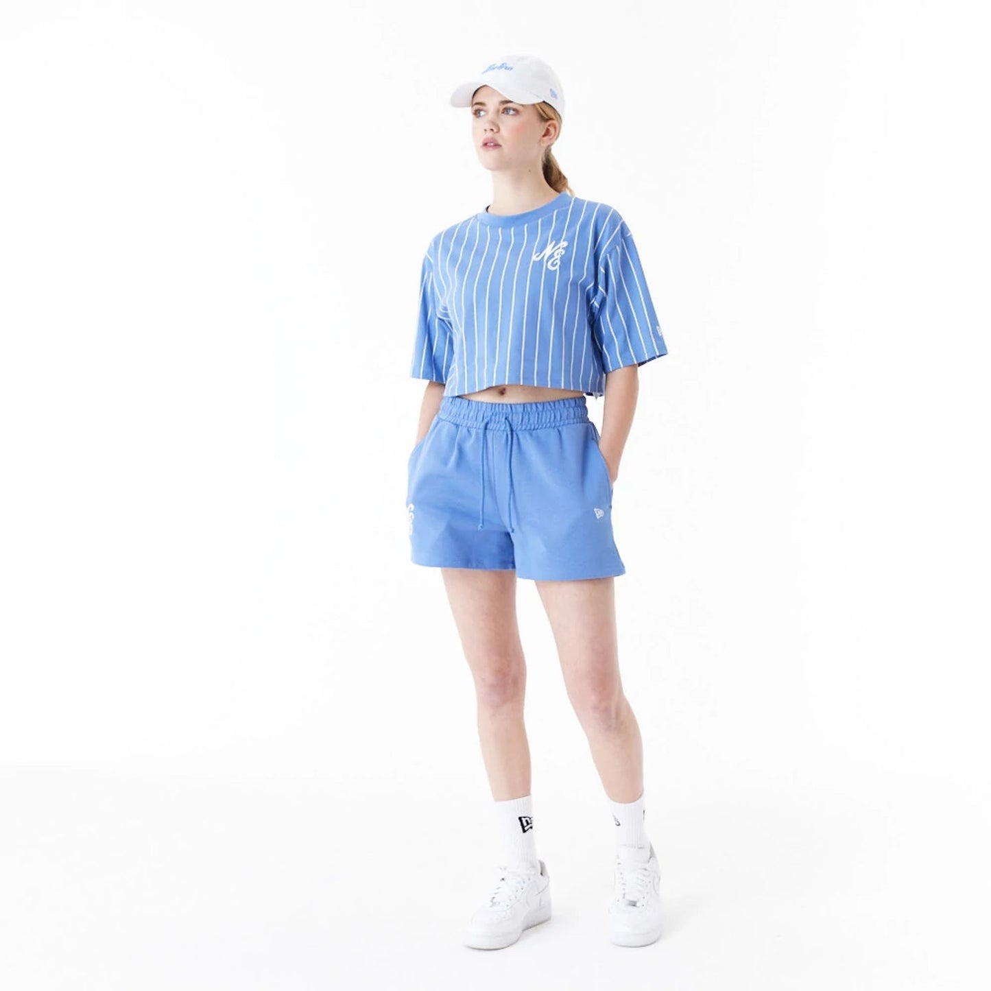 The Female model is wearing New Era Pinstripe Blue Womens Crop T-Shirt 6