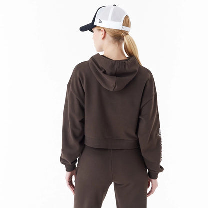 The Female model is wearing New York Yankees MLB Lifestyle Brown Womens Crop Pullover Hoodie 2