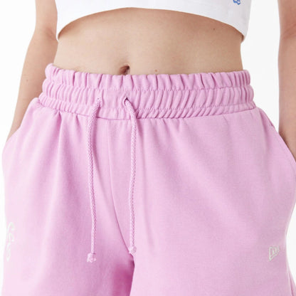 The Female model is wearing New Era Pink Womens Sweat Shorts 6