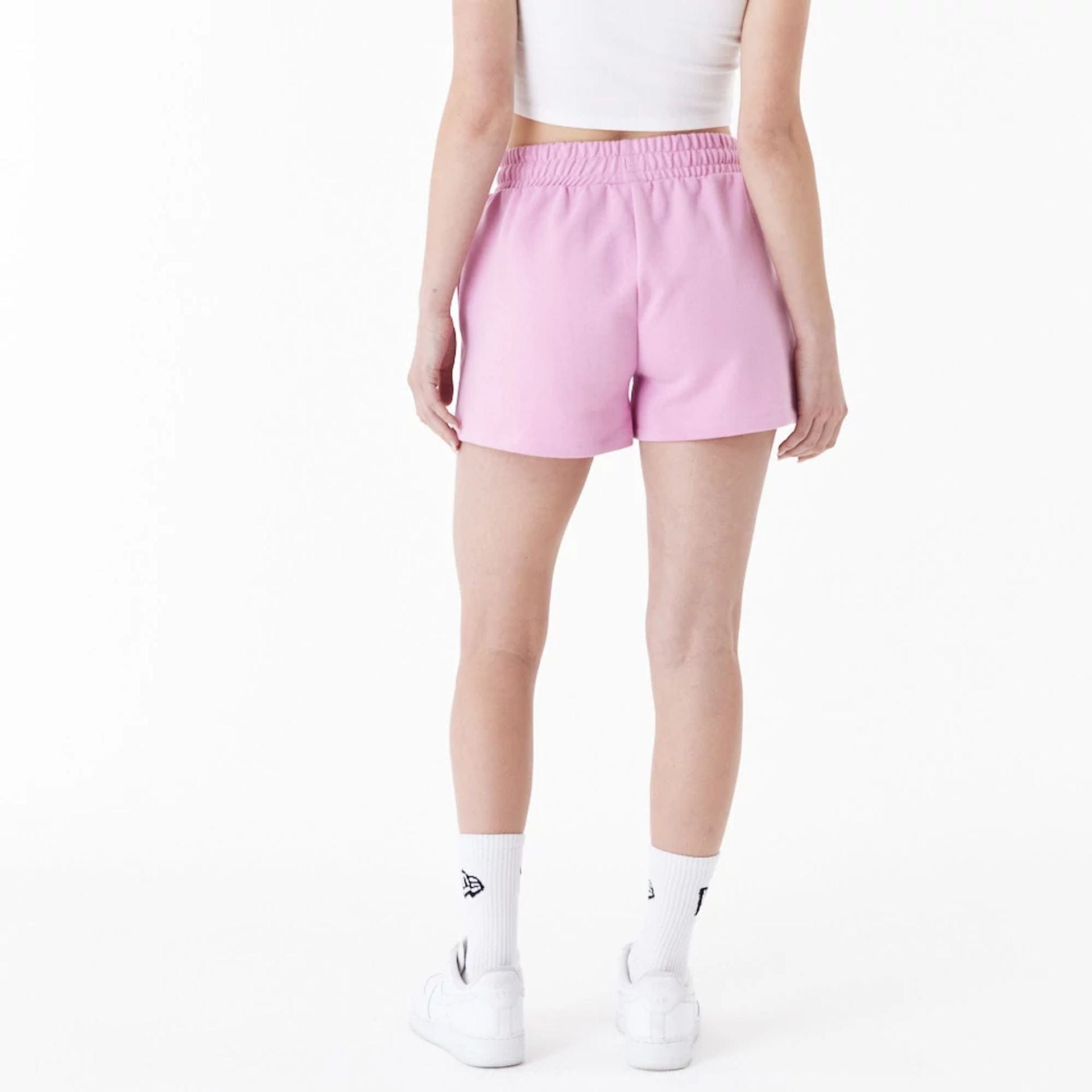 The Female model is wearing New Era Pink Womens Sweat Shorts 4