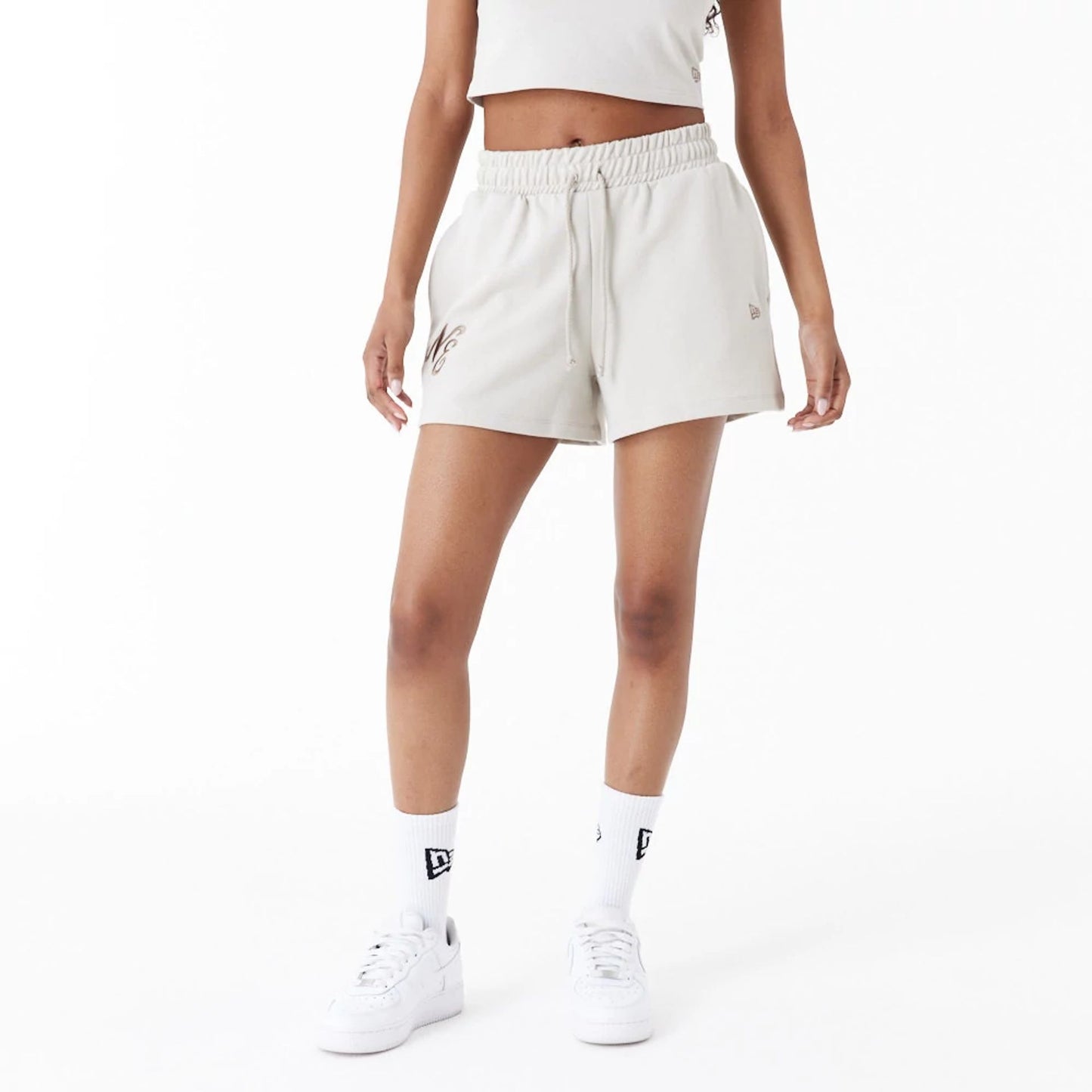 The Female model is wearing New Era Stone Womens Sweat Shorts 4