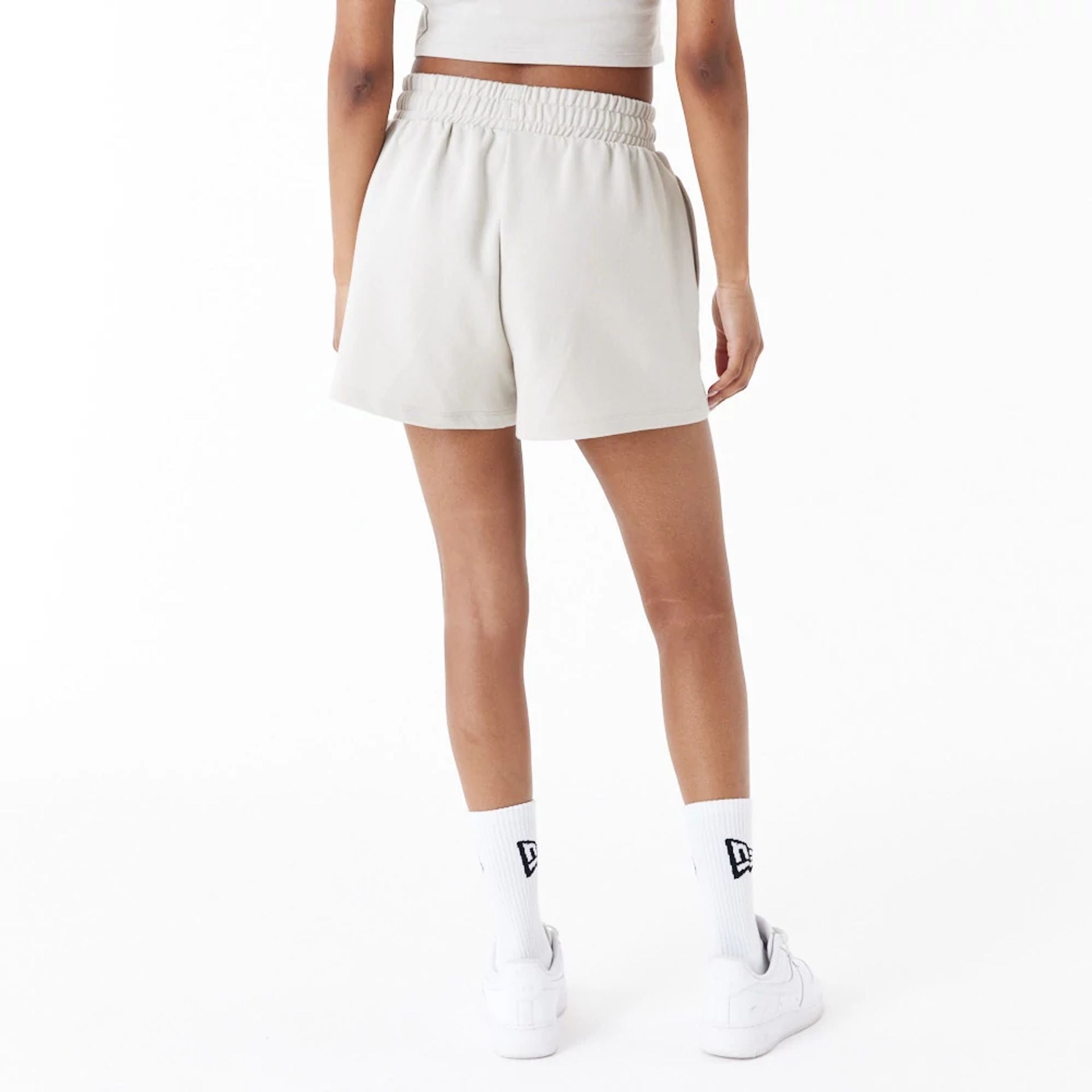 The Female model is wearing New Era Stone Womens Sweat Shorts 6