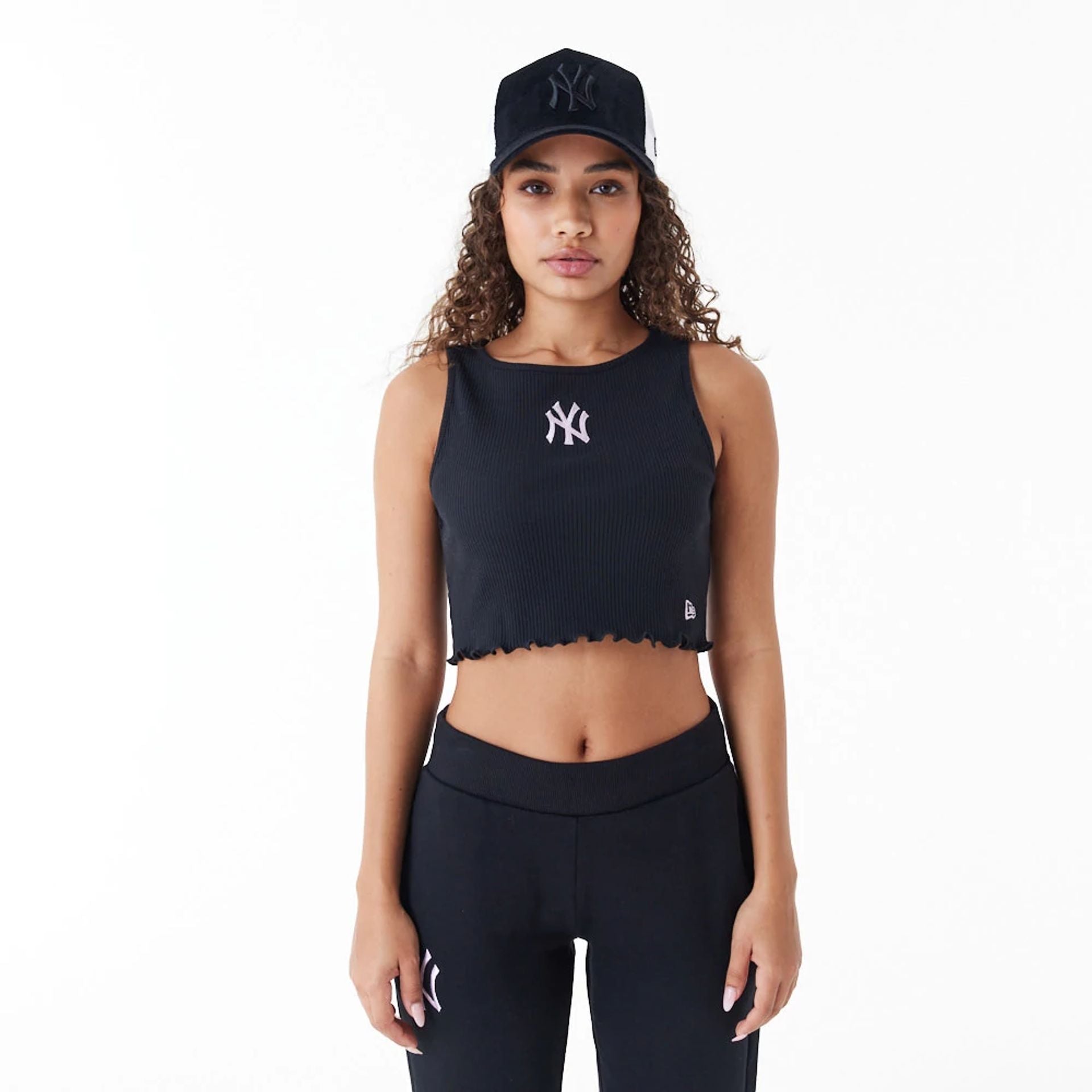 The Female model is wearing New York Yankees MLB Lifestyle Black Womens Crop Tank Top 1