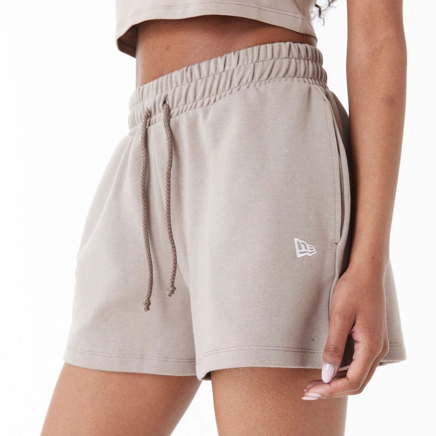 The Female model is wearing New Era Brown Womens Sweat Shorts 6