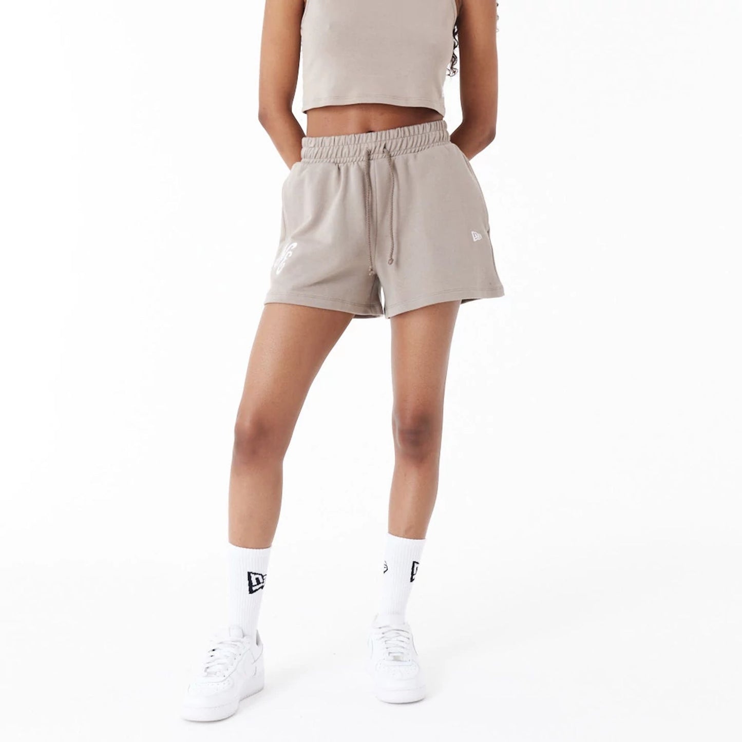 The Female model is wearing New Era Brown Womens Sweat Shorts 8