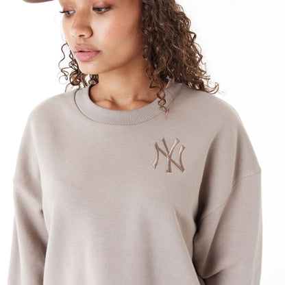 The Female model is wearing New York Yankees Womens MLB Lifestyle Brown Crop Crew Neck Sweatshirt 8