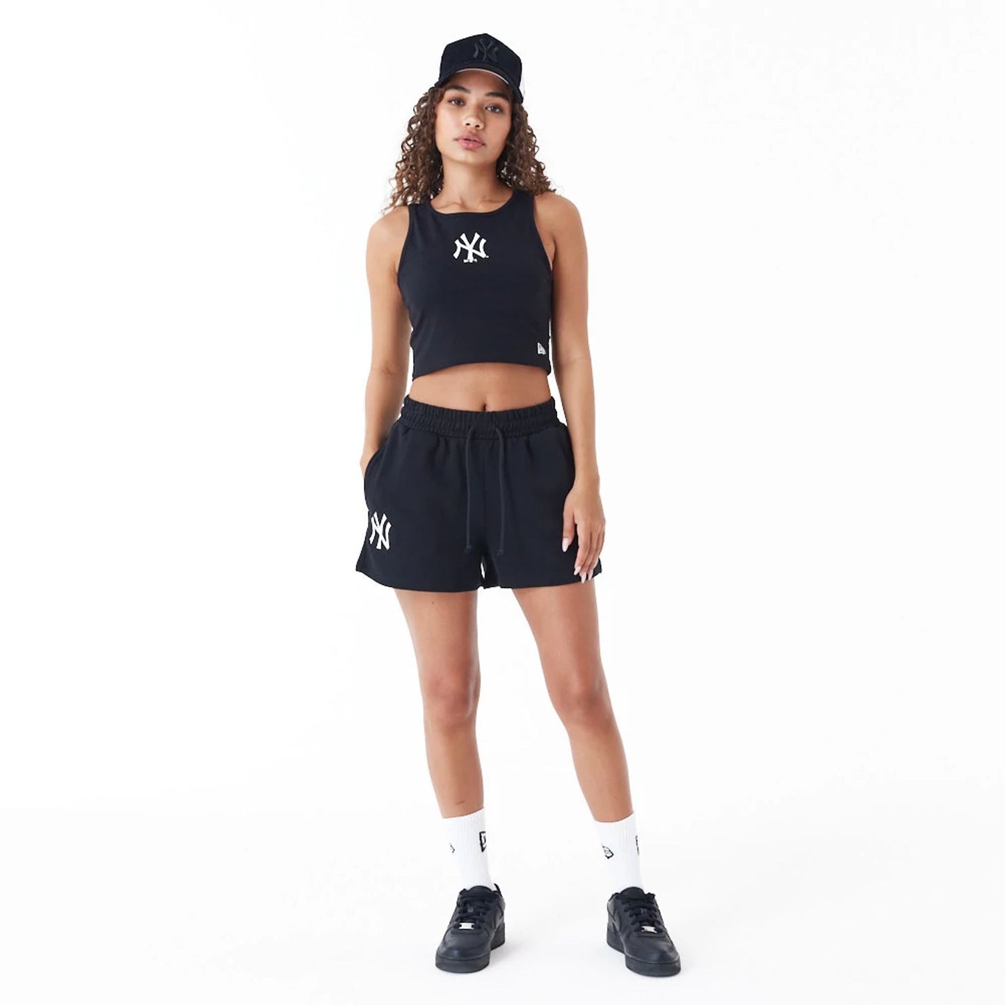 The Female model is wearing New York Yankees Womens MLB Lifestyle Black Shorts 4