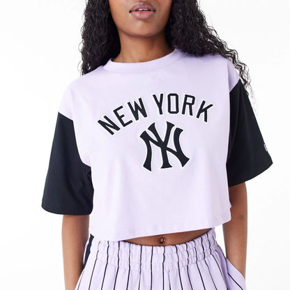 The Female model is wearing New York Yankees MLB Lifestyle Purple Womens Crop T-Shirt 6