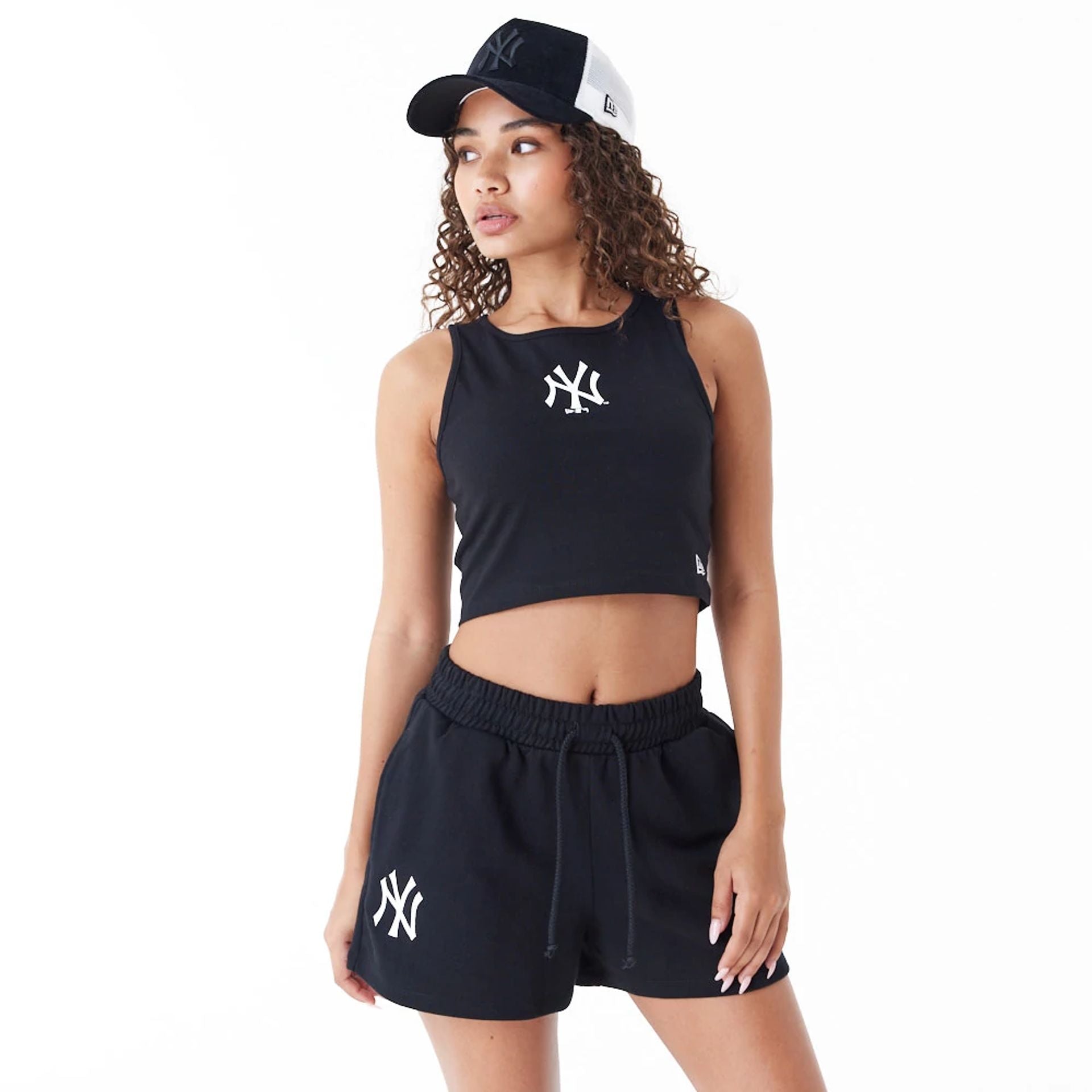 The Female model is wearing New York Yankees Womens MLB Lifestyle Black Crop Tank Top 5