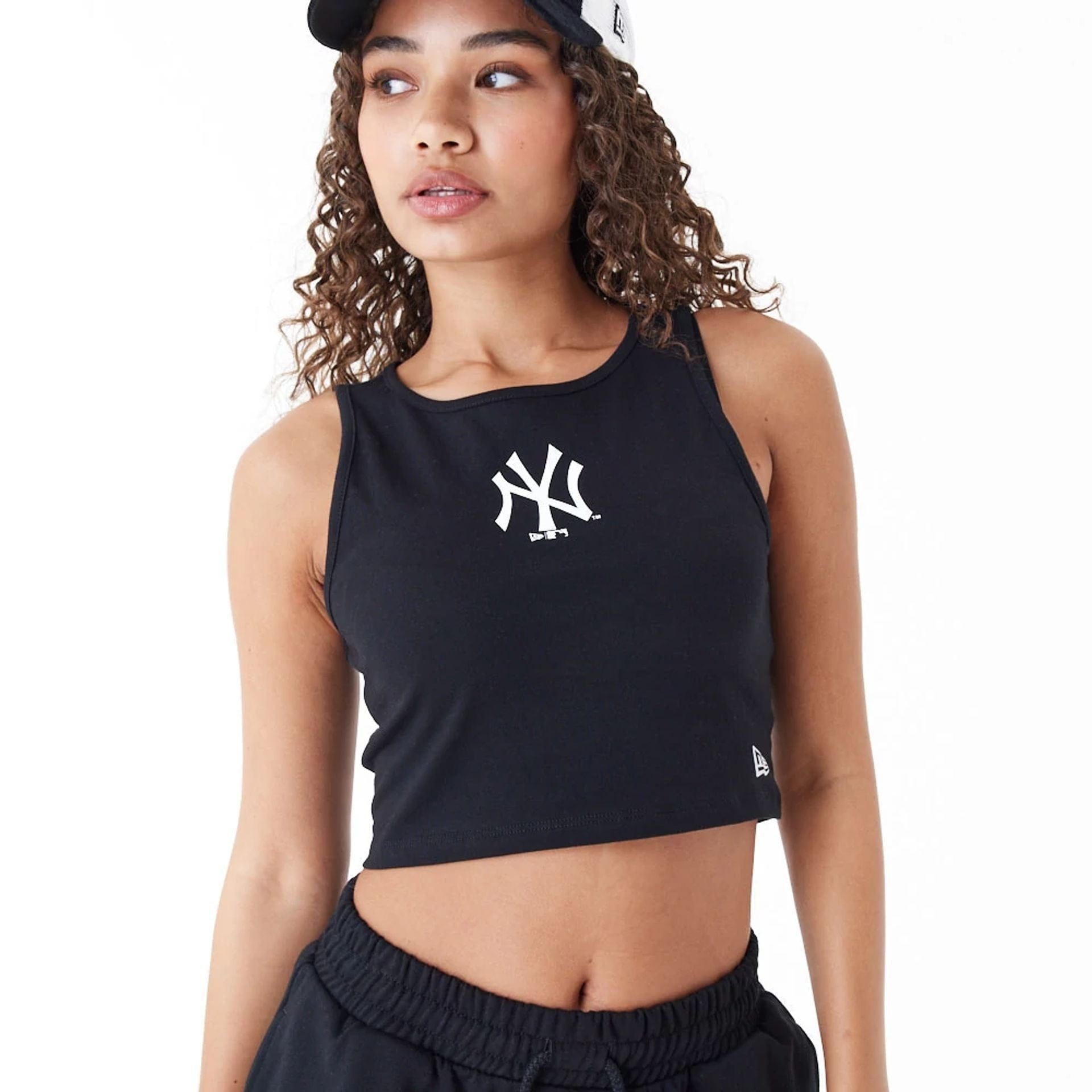 The Female model is wearing New York Yankees Womens MLB Lifestyle Black Crop Tank Top 1