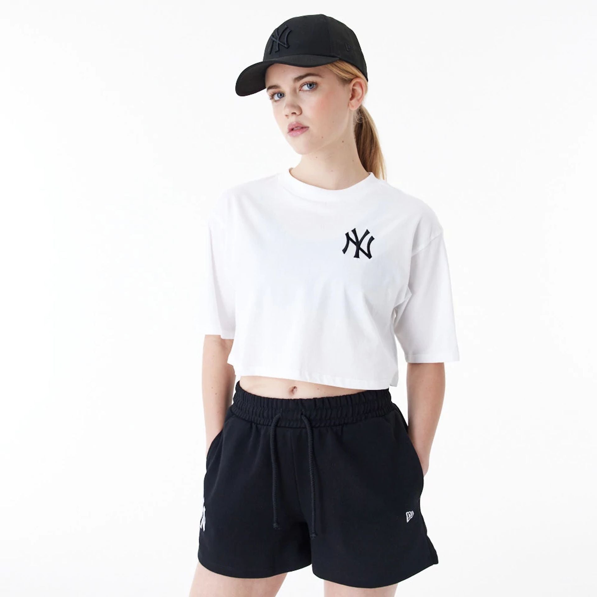 The Female model is wearing New York Yankees Womens MLB Lifestyle White Crop T-Shirt 1