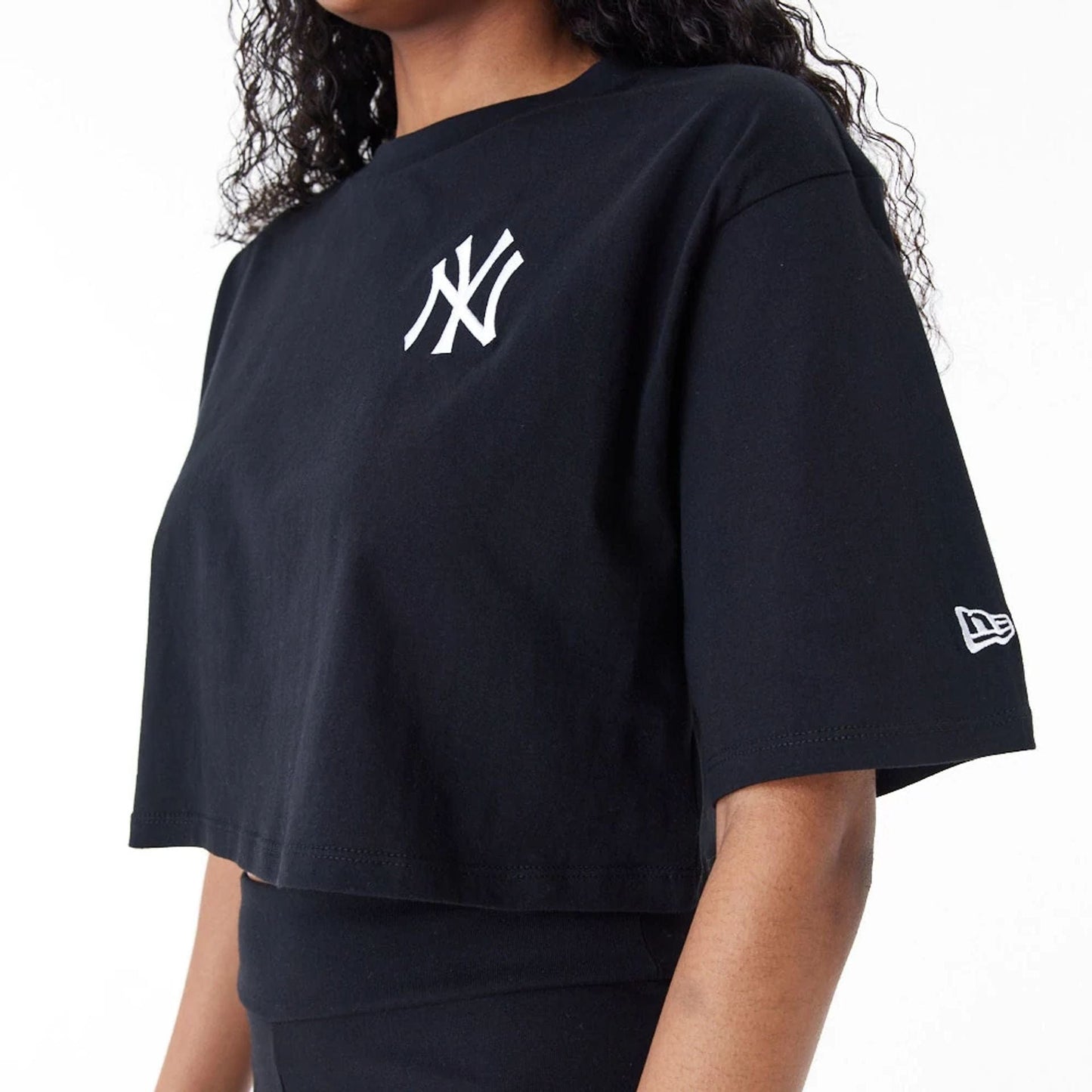 The Female model is wearing New York Yankees Womens MLB Lifestyle Black Crop T-Shirt 6