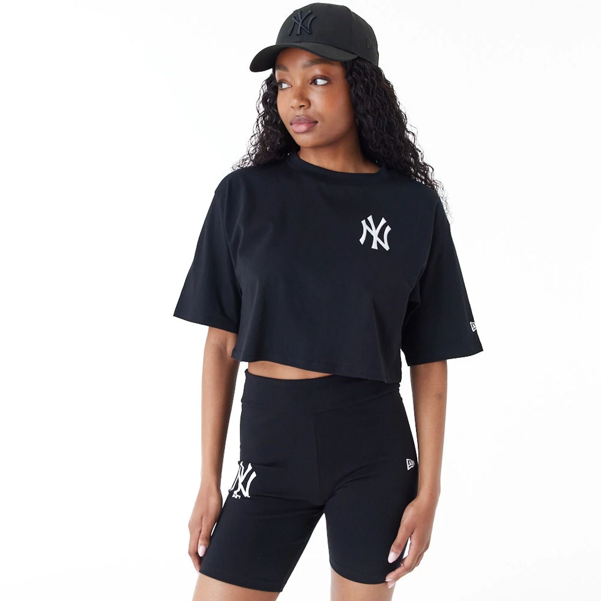 The Female model is wearing New York Yankees Womens MLB Lifestyle Black Crop T-Shirt 1