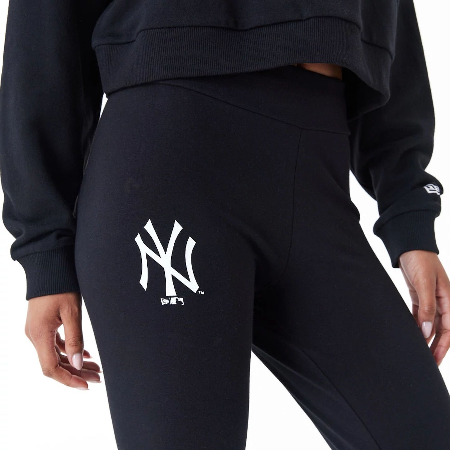 The Female model is wearing New York Yankees Womens MLB Lifestyle Black Leggings 8