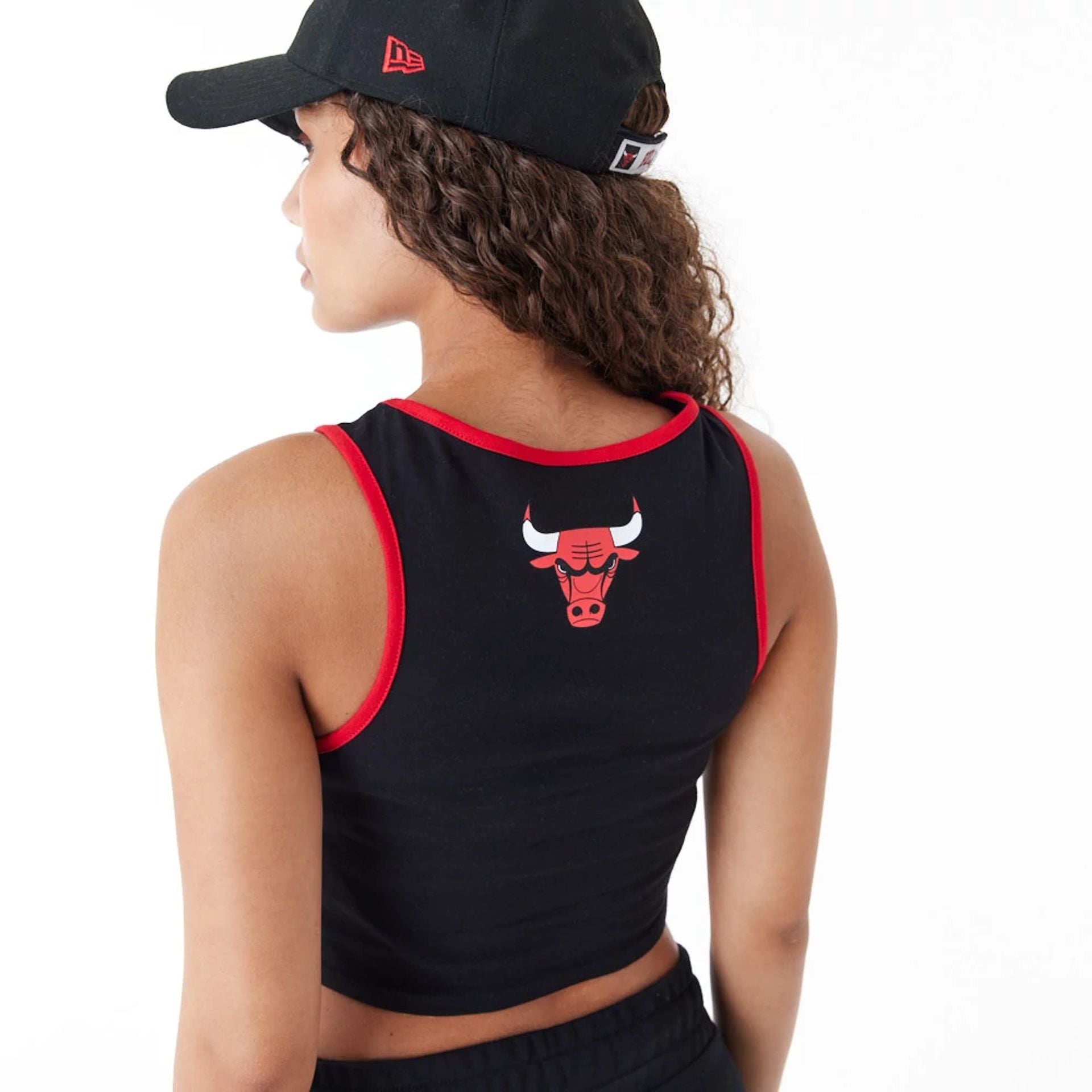 The Female model is wearing Chicago Bulls Womens Womens NBA Team Wordmark Black Crop Tank Top 5