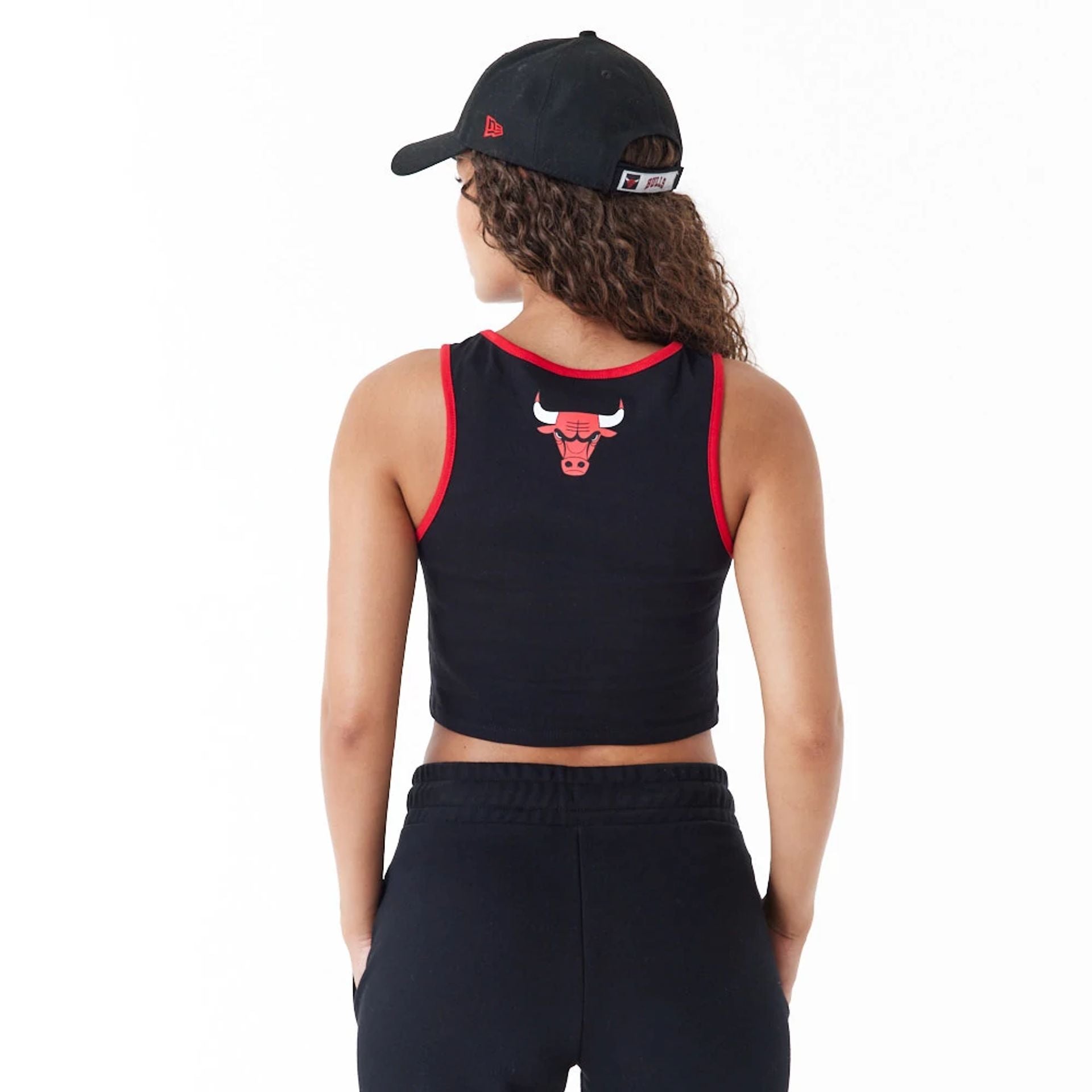 The Female model is wearing Chicago Bulls Womens Womens NBA Team Wordmark Black Crop Tank Top 3