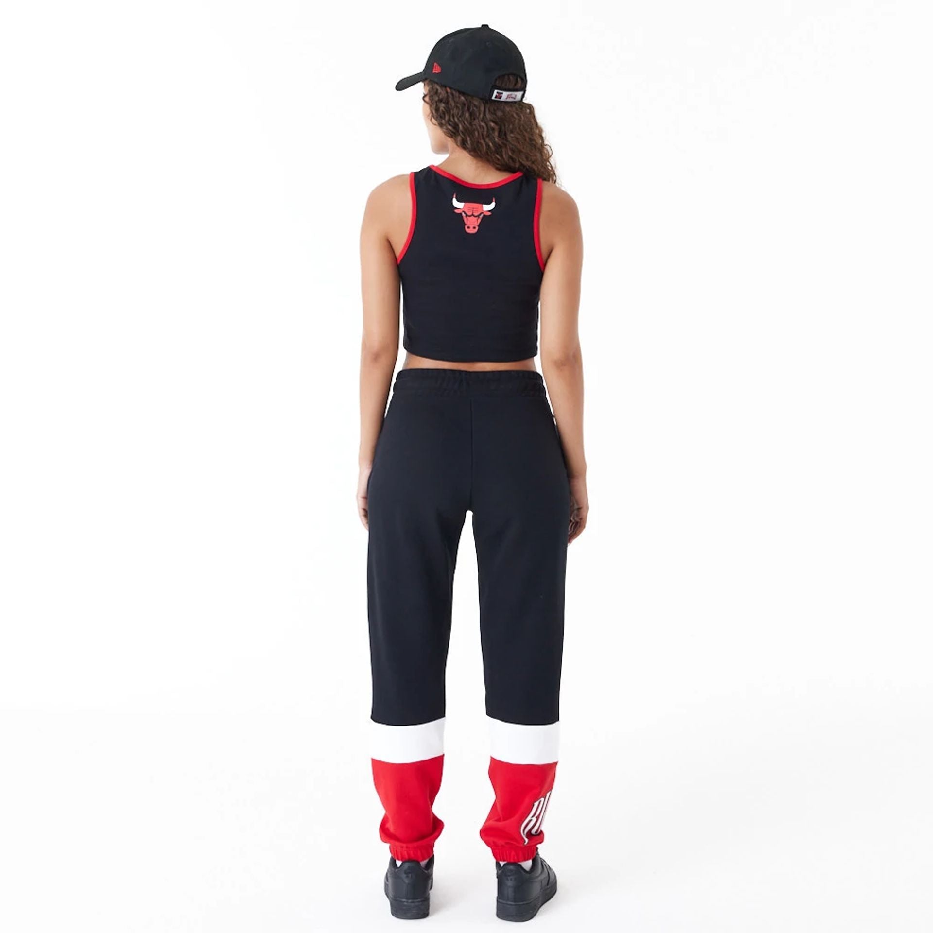 The Female model is wearing Chicago Bulls Womens Womens NBA Team Wordmark Black Crop Tank Top 2